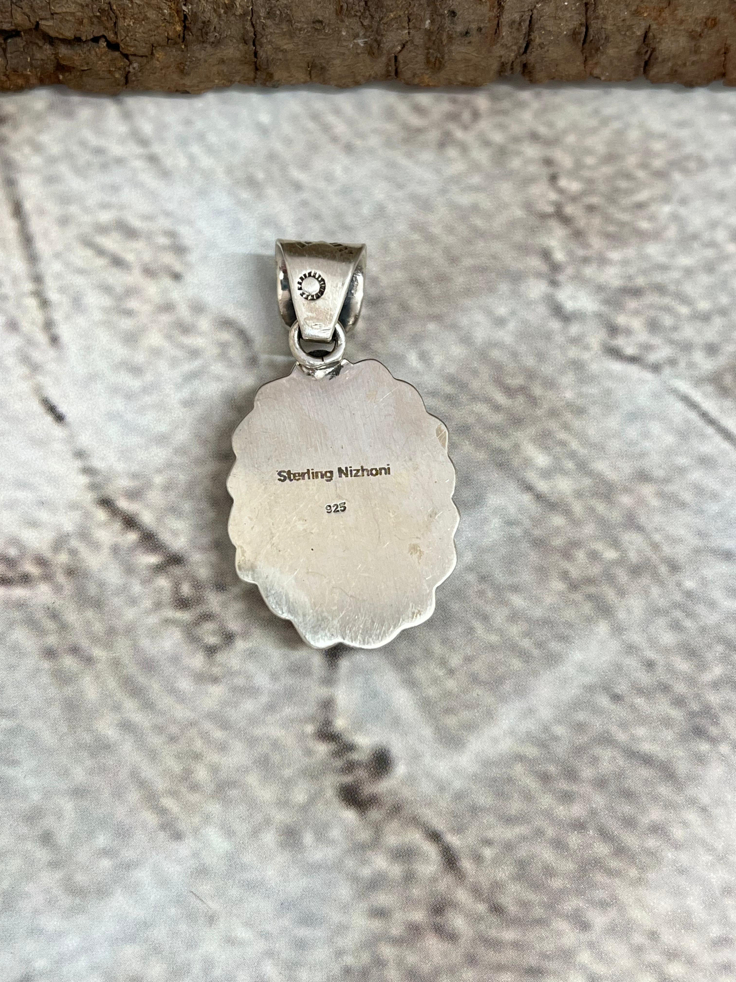 Handmade Sterling Silver White Buffalo Turquoise Pendant with Signed Nizhoni