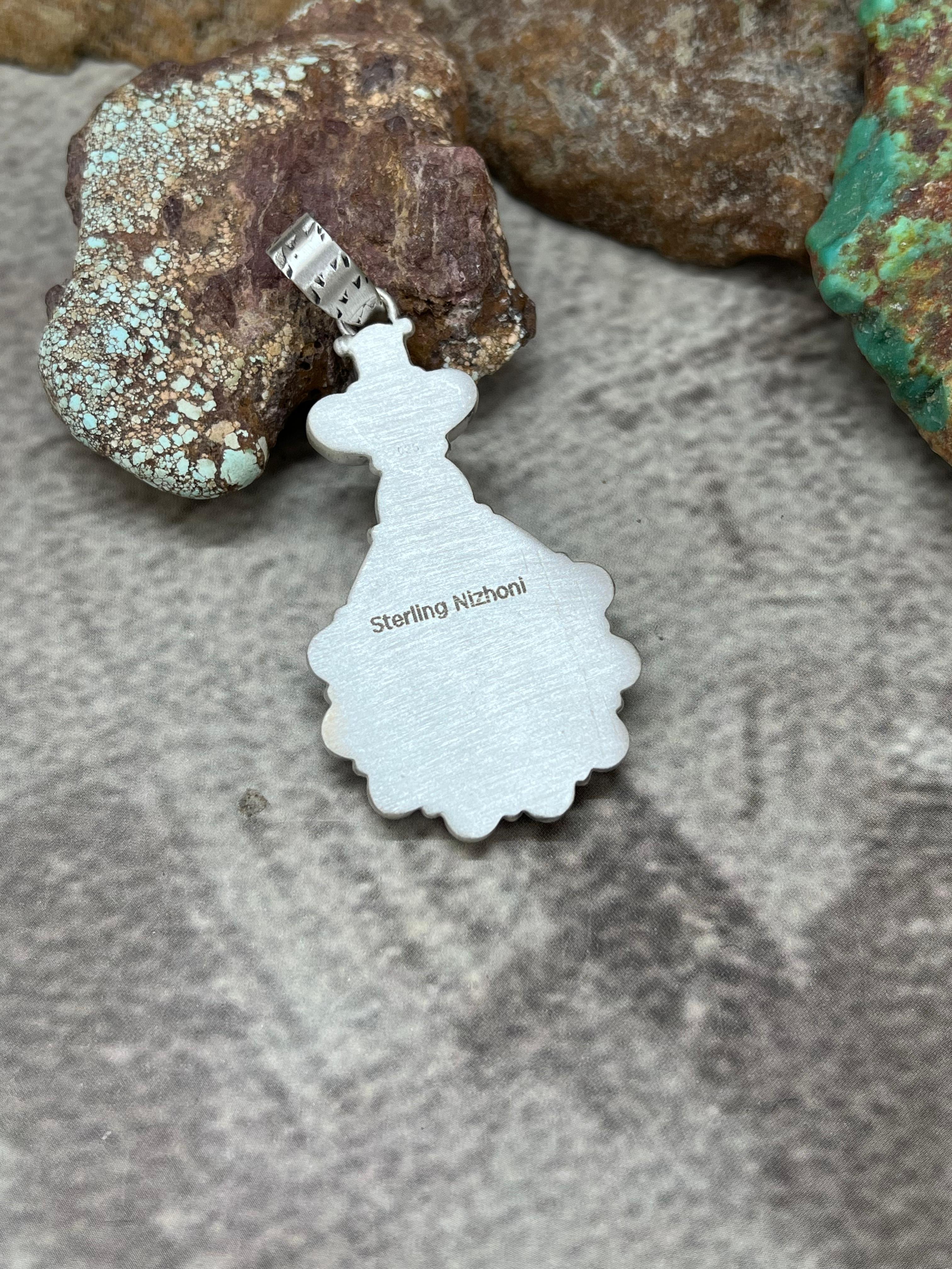 Handmade Sterling Silver White Buffalo Pendant with Signed Nizhoni