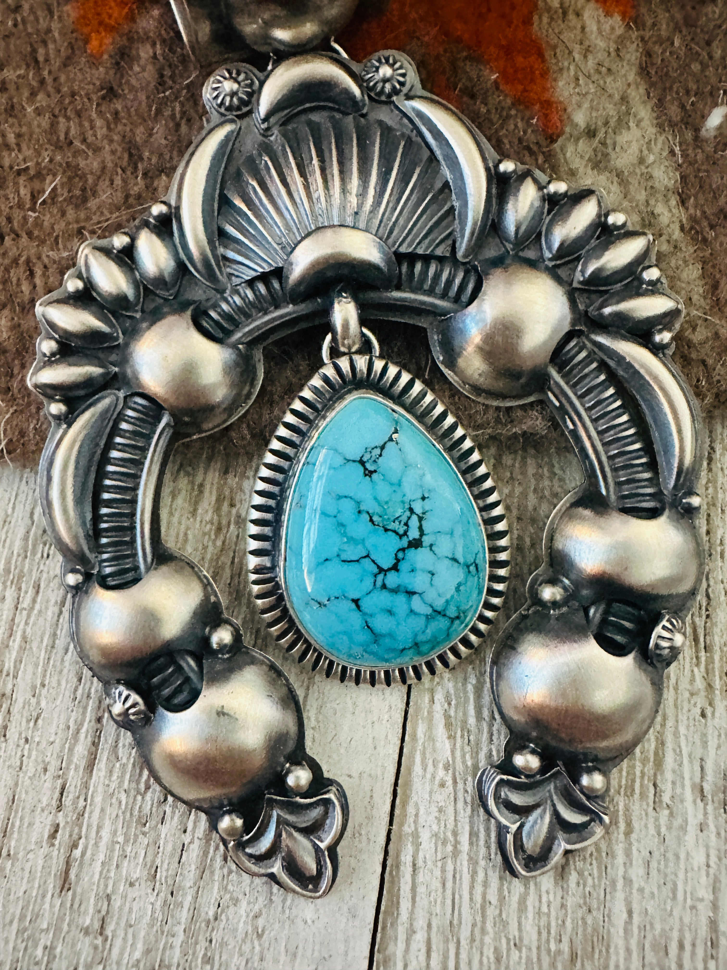 Handcrafted Sterling Silver & Turquoise Naja Pendant by Delbert Gordon