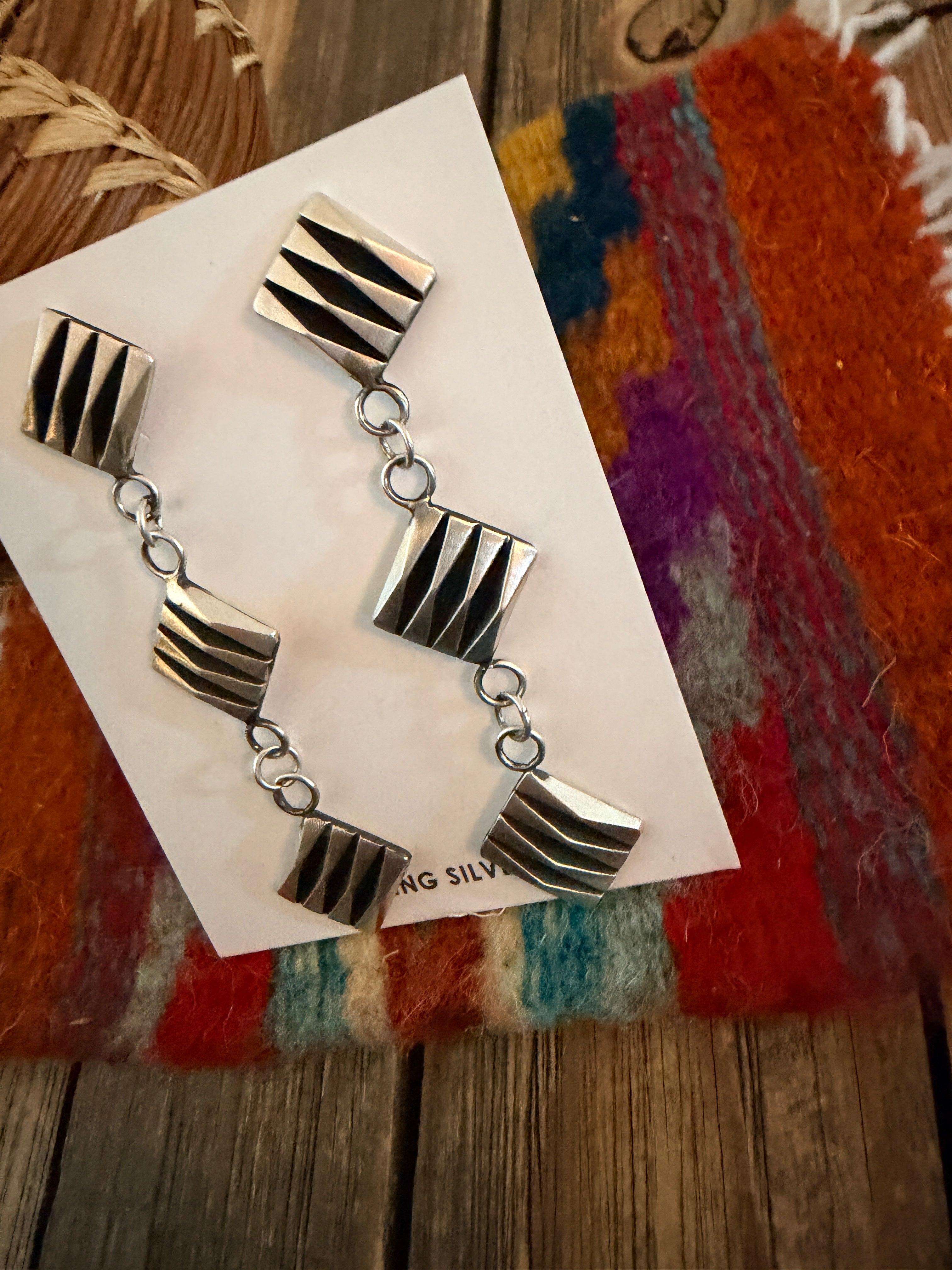 Handcrafted Sterling Silver Dangle Earrings by Leander Tahe
