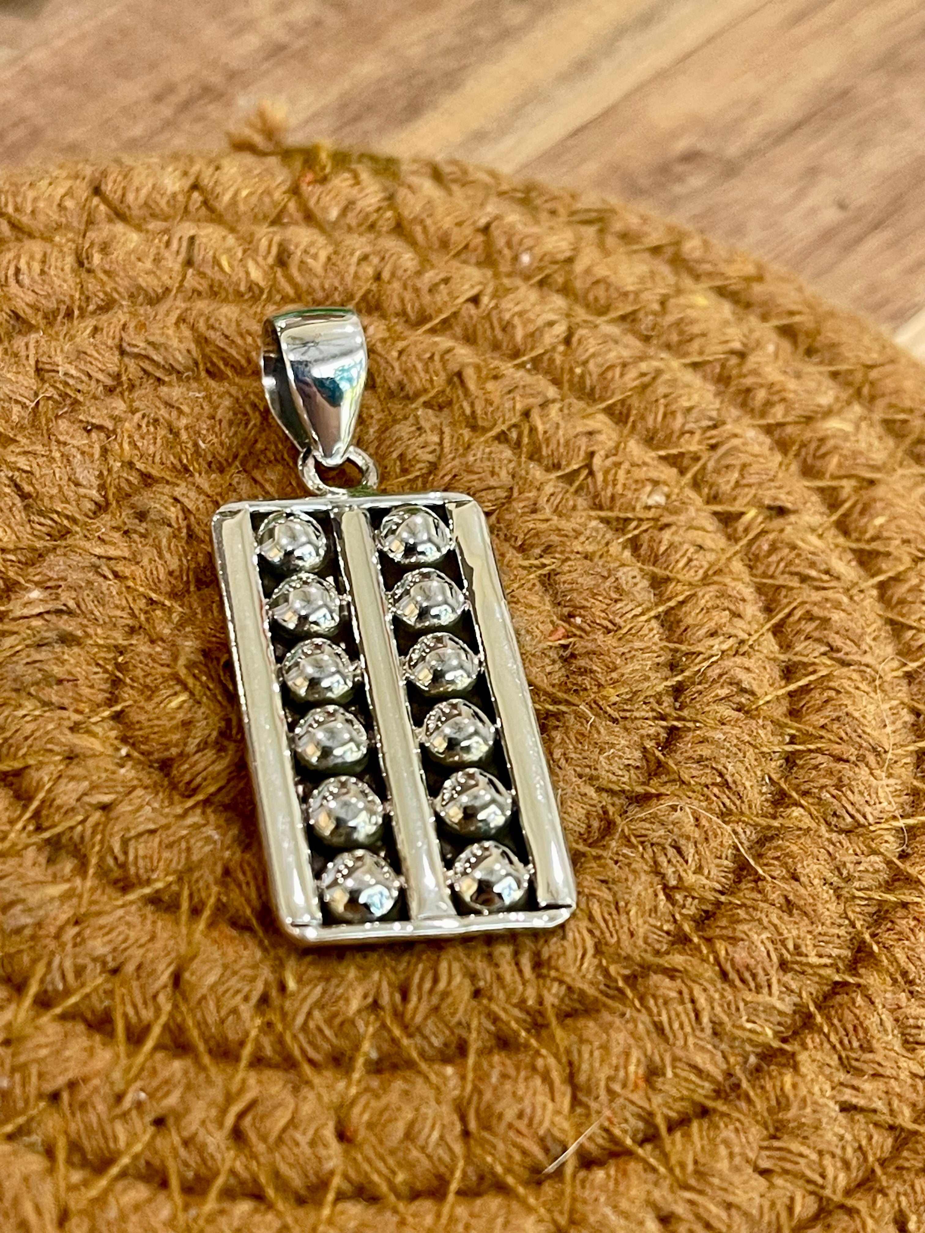 Handmade Sterling Silver Bar Pendant with Signed Nizhoni