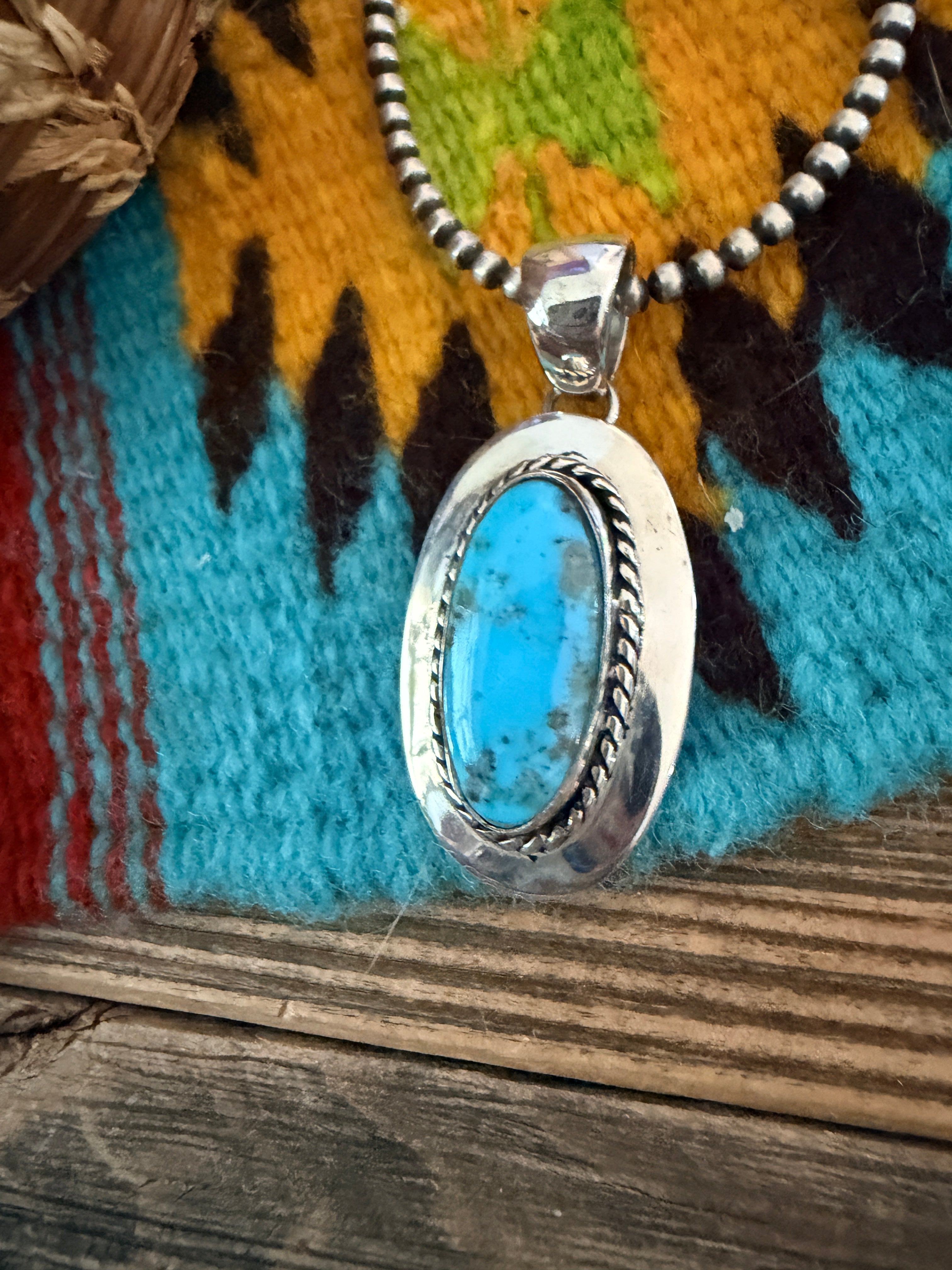 Handcrafted Sterling Silver and Turquoise Pendant by Wilford Begay