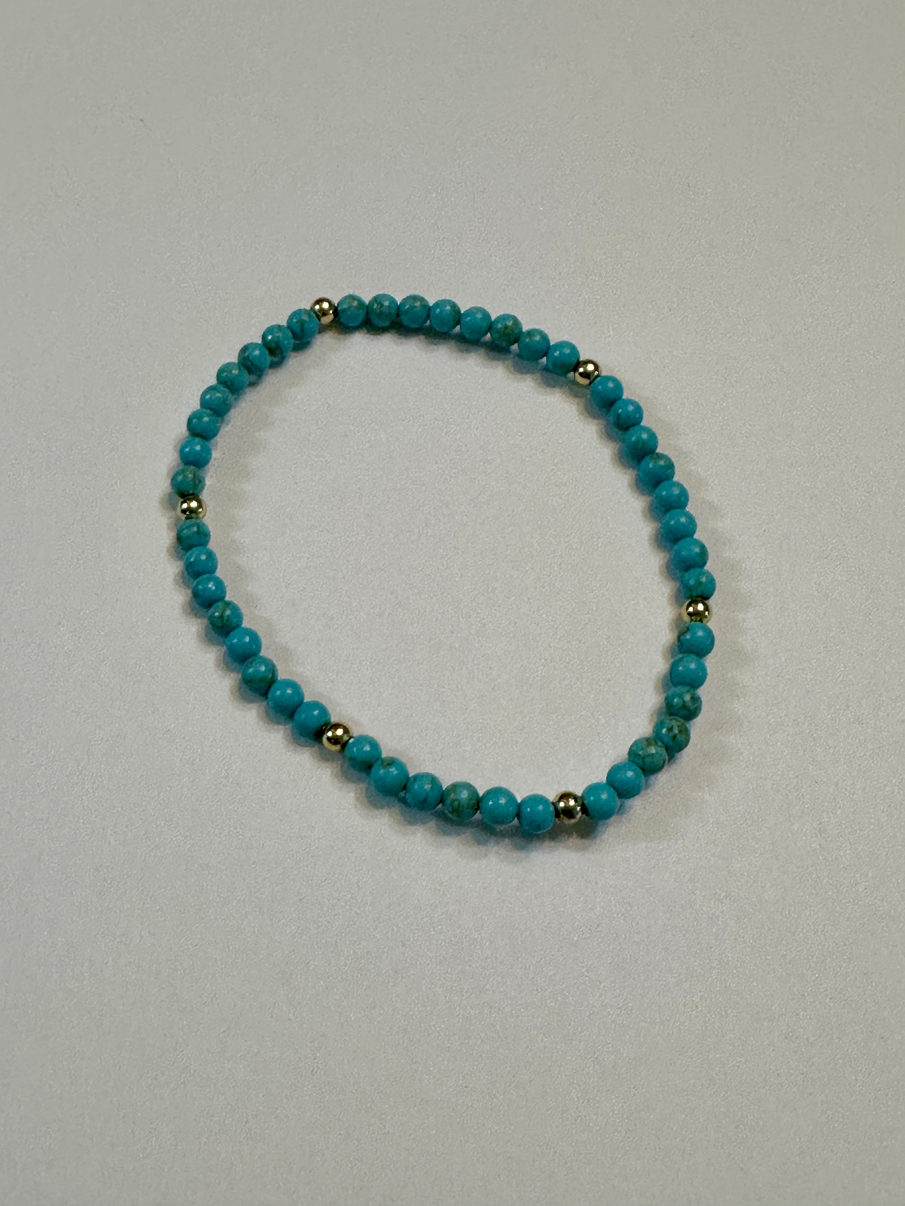 Turquoise Stretch Bracelet With Gold Plated Beads