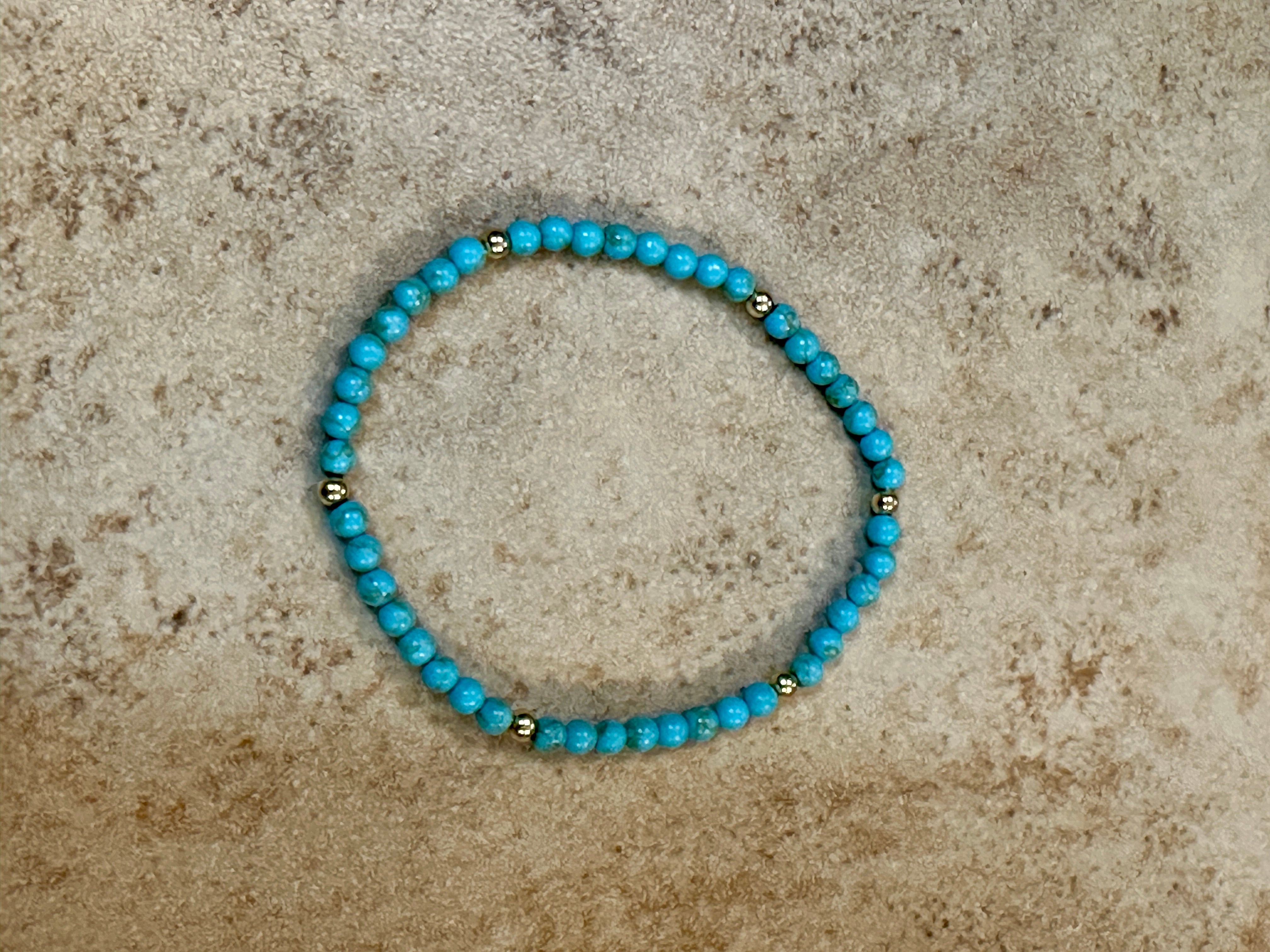 Turquoise Stretch Bracelet With Gold Plated Beads