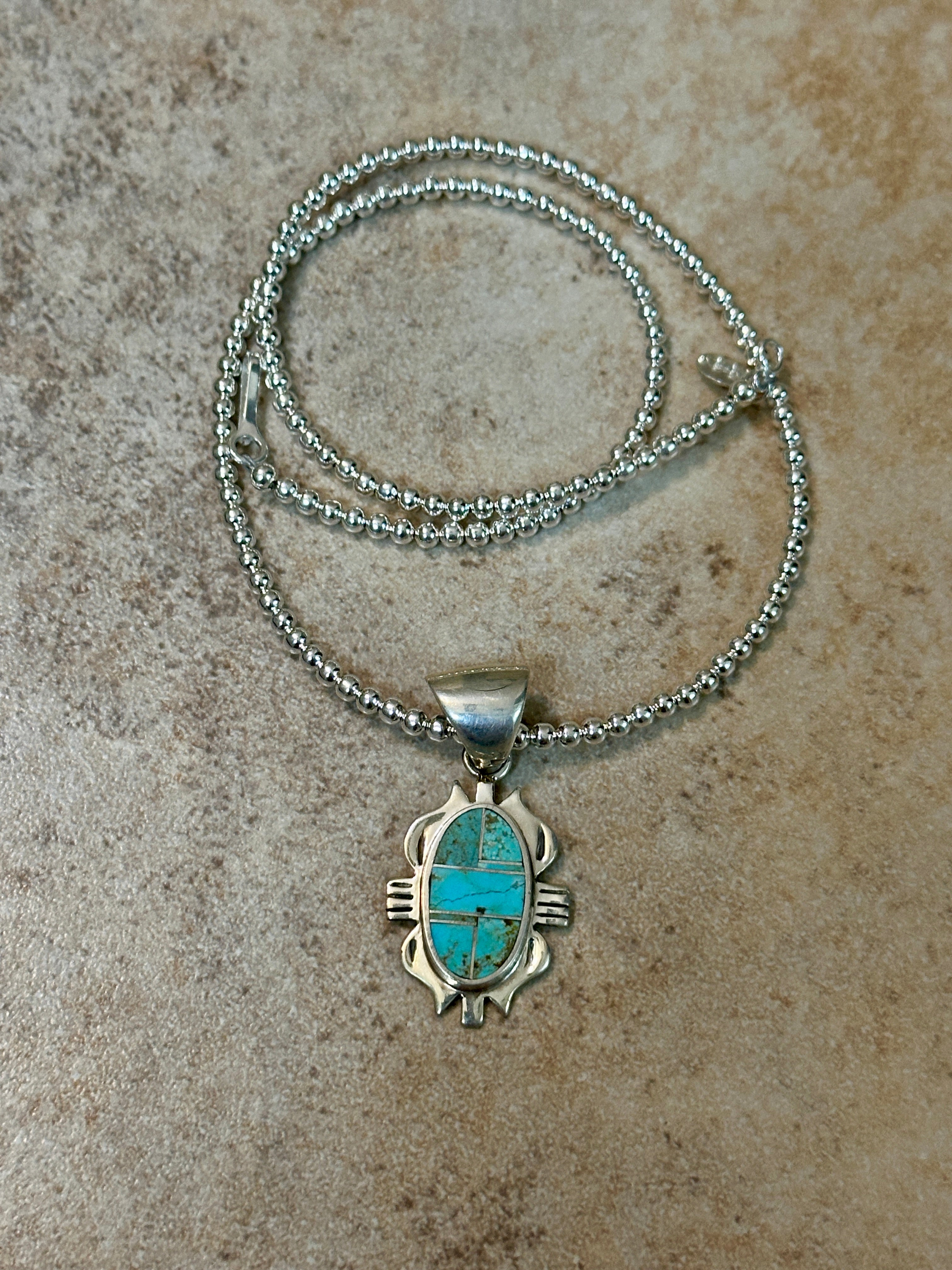 Handcrafted Turquoise 8 & Sterling Silver Jagged Oval Pendant