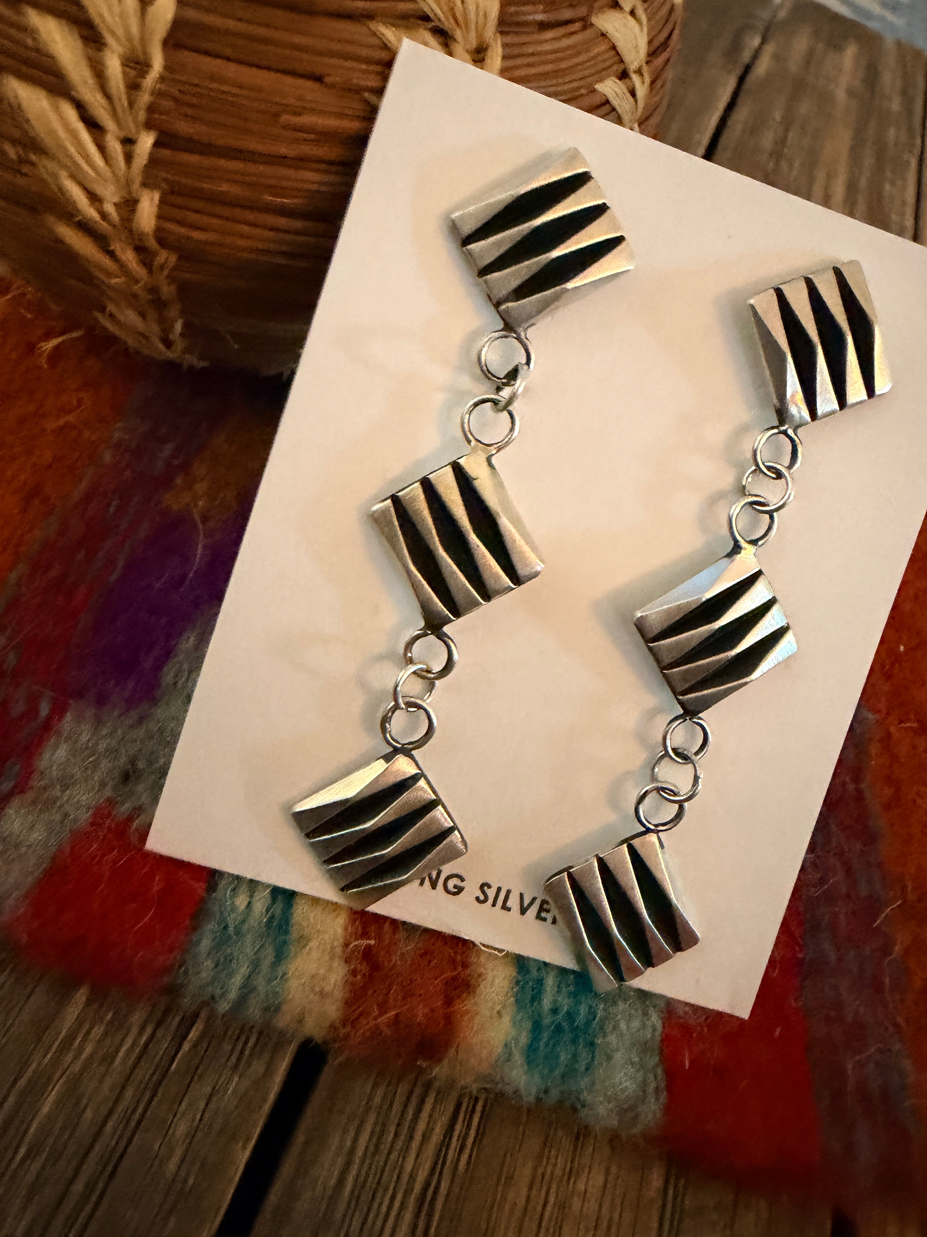 Handcrafted Sterling Silver Dangle Earrings by Leander Tahe
