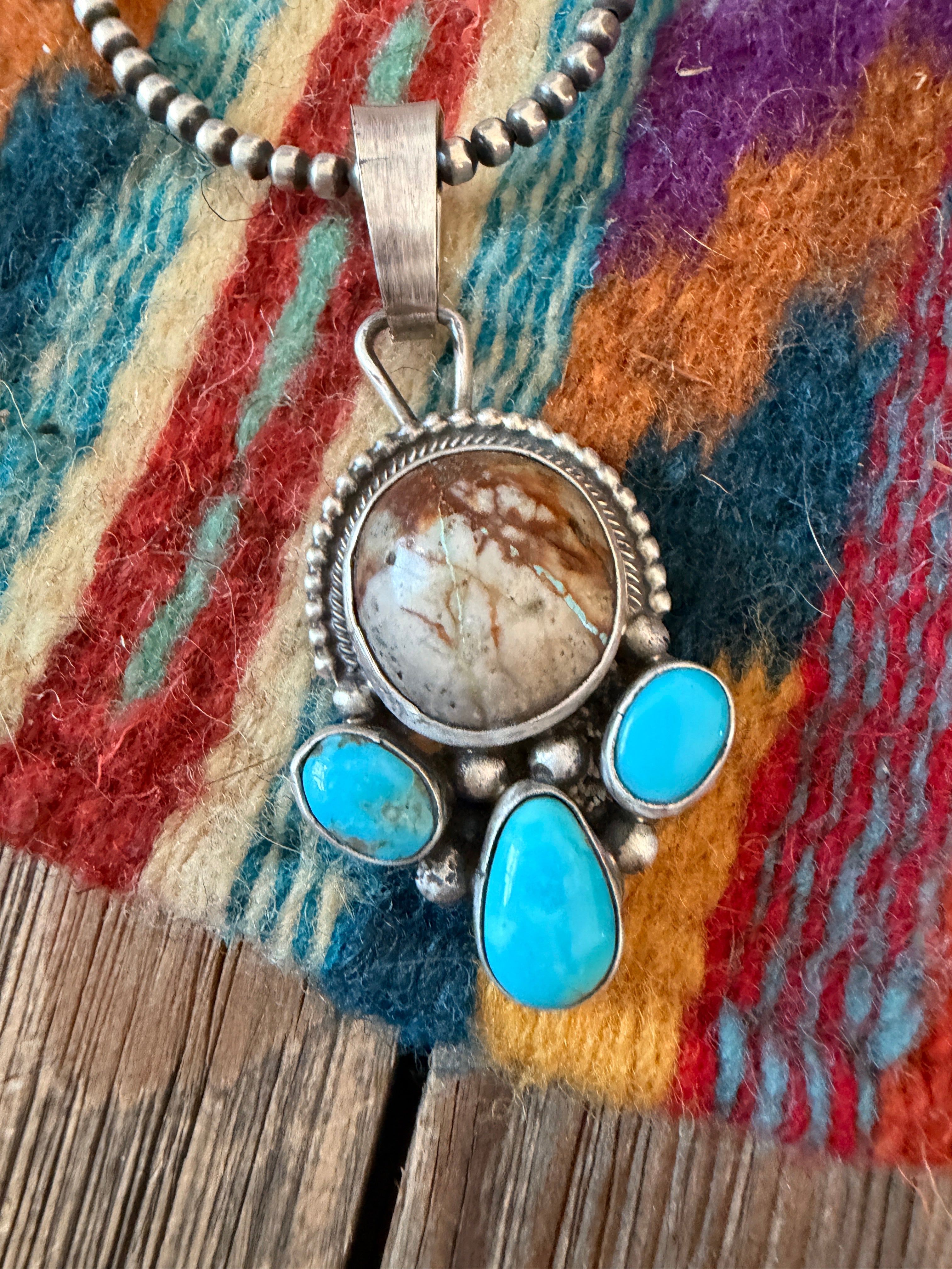 Handcrafted Sterling Silver & Turquoise Pendant by Travis Jim