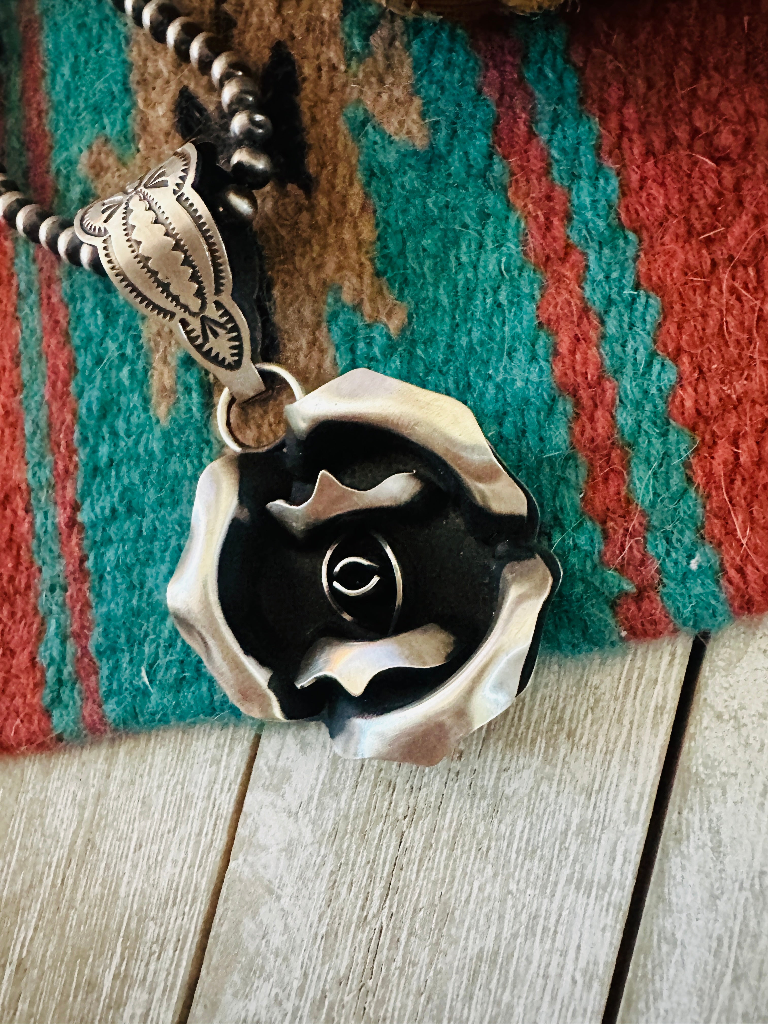 Handcrafted Sterling Silver Rose Pendant by Leander Tahe