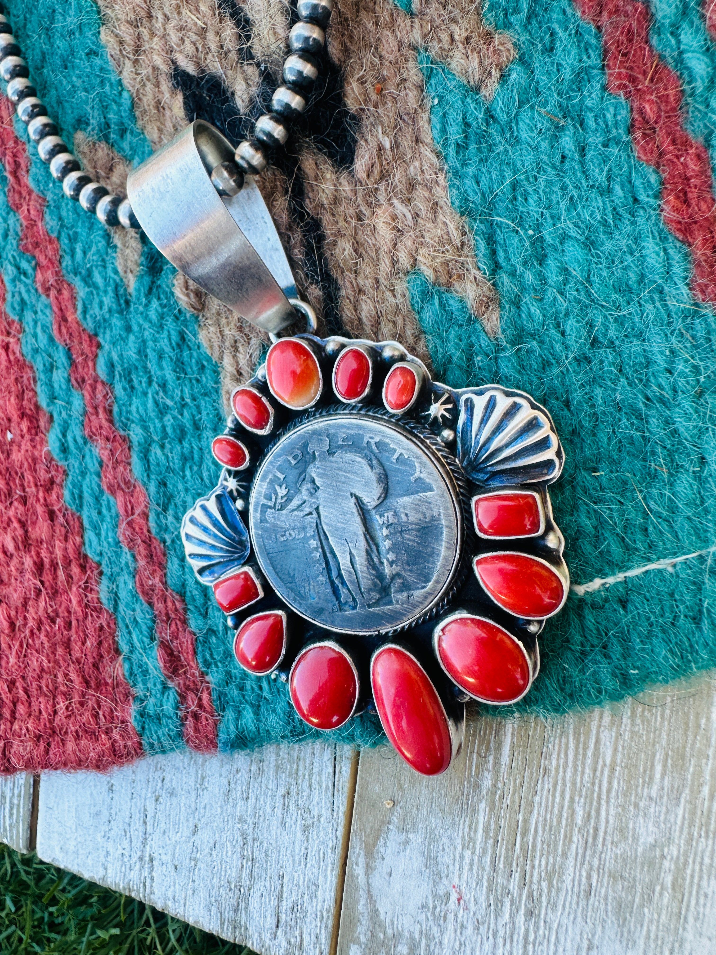 Handcrafted Sterling Silver and Coral Liberty Coin Pendant by Randy Boyd