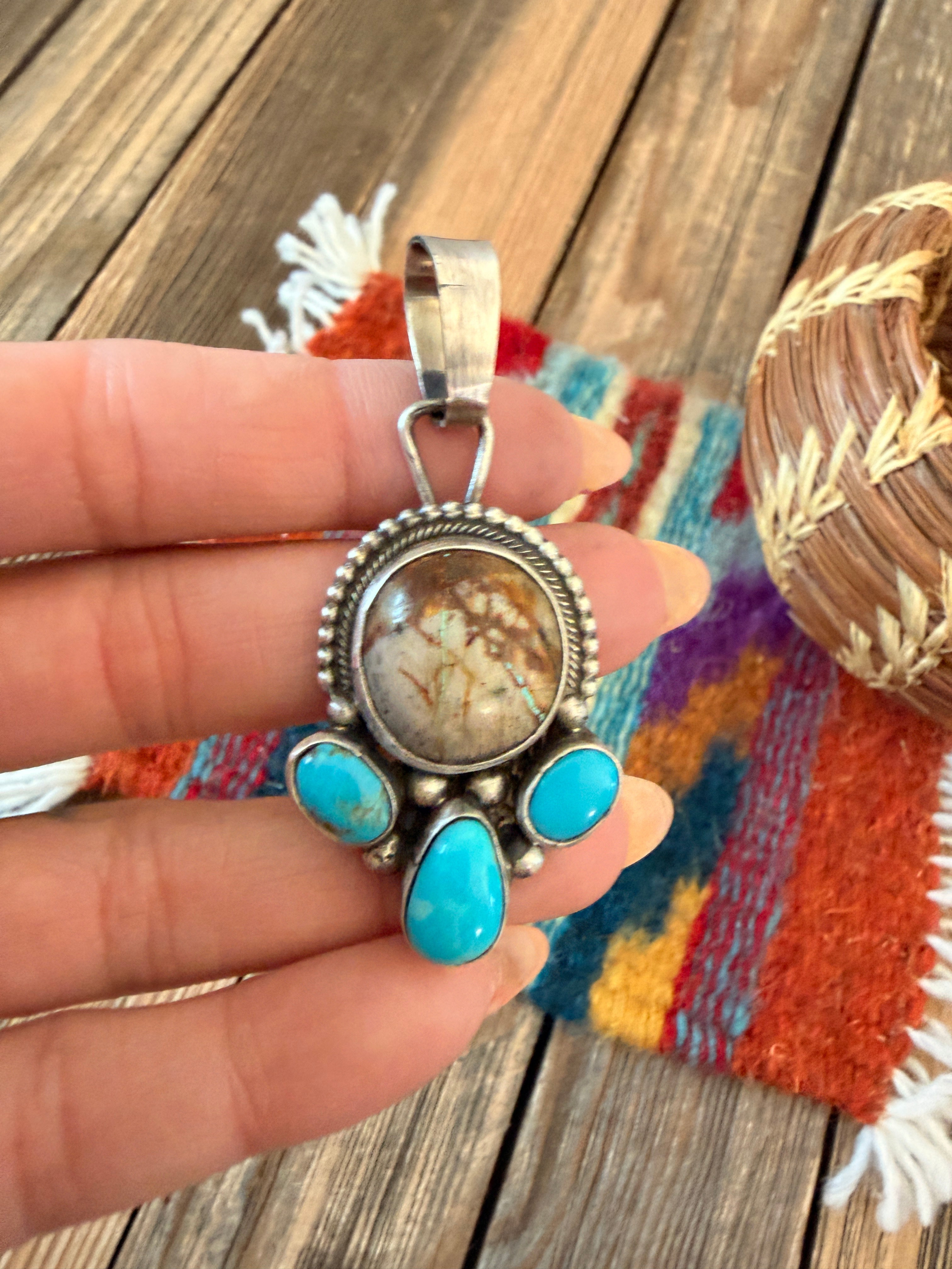 Handcrafted Sterling Silver & Turquoise Pendant by Travis Jim