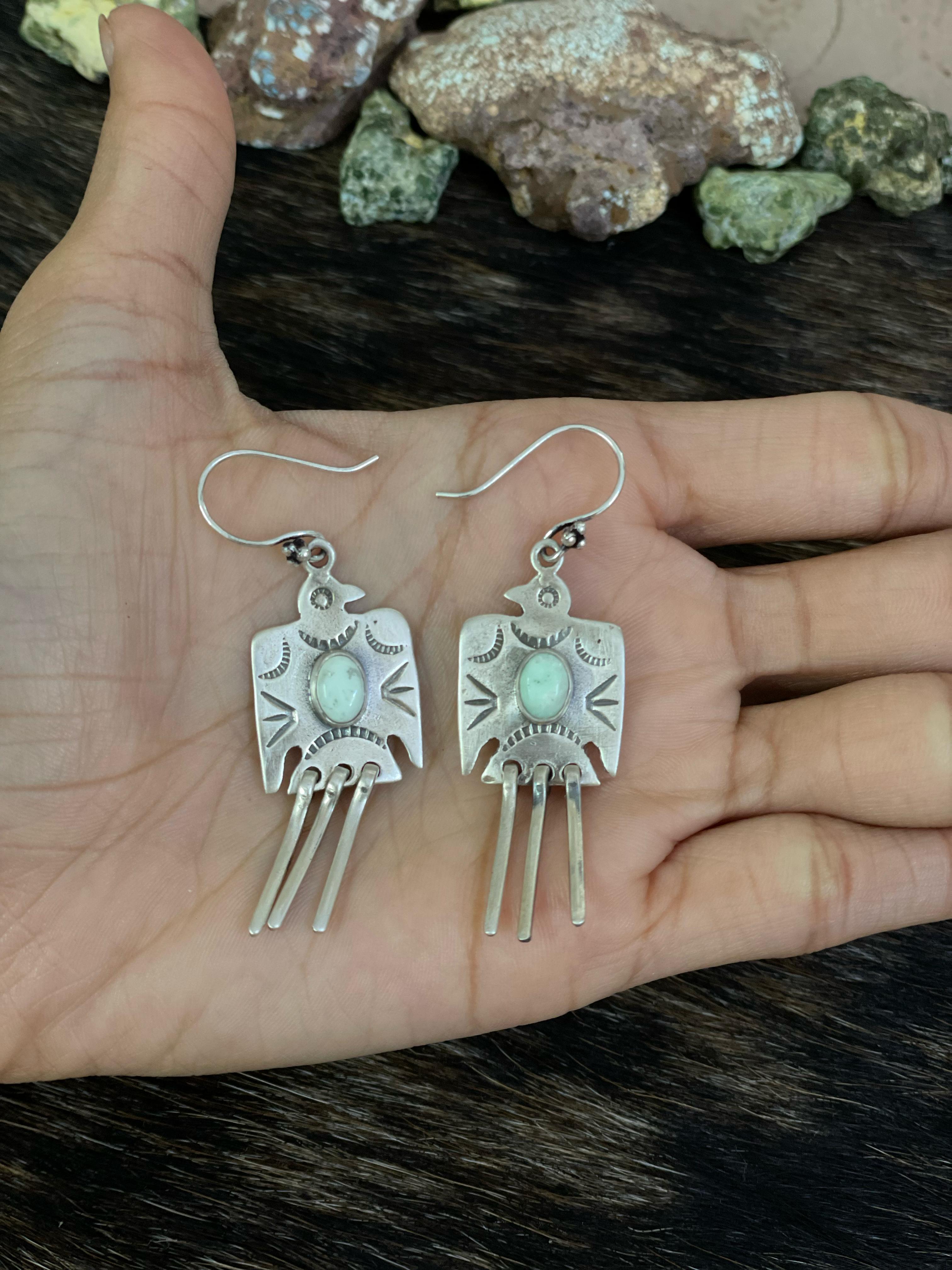 Handmade Sterling Silver White Buffalo, Kingman, Paloma Turquoise Dangle Thunder Bird Earrings with Signed Nizhoni