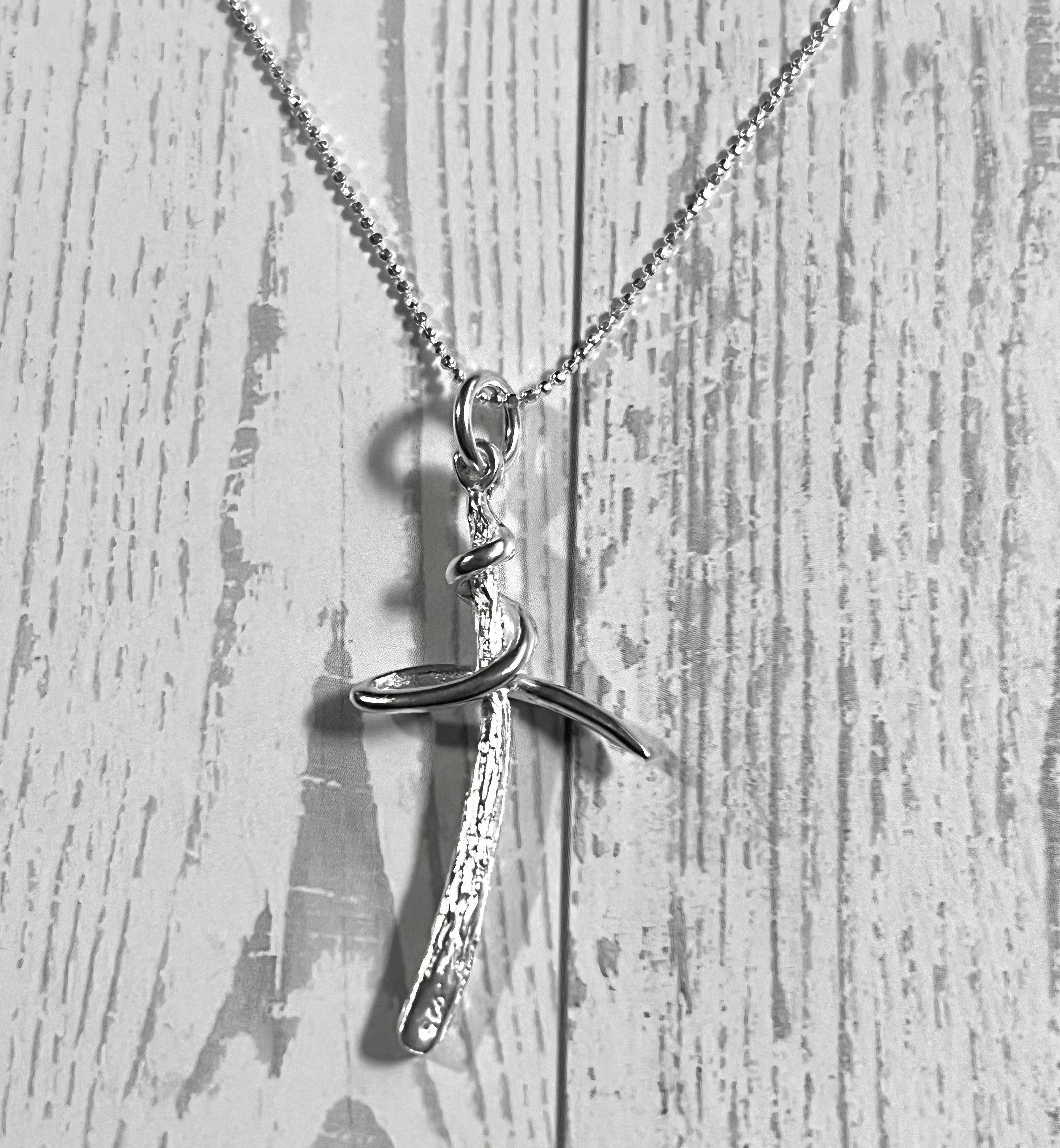 Sterling Silver Textured Cross Necklace With Swirl