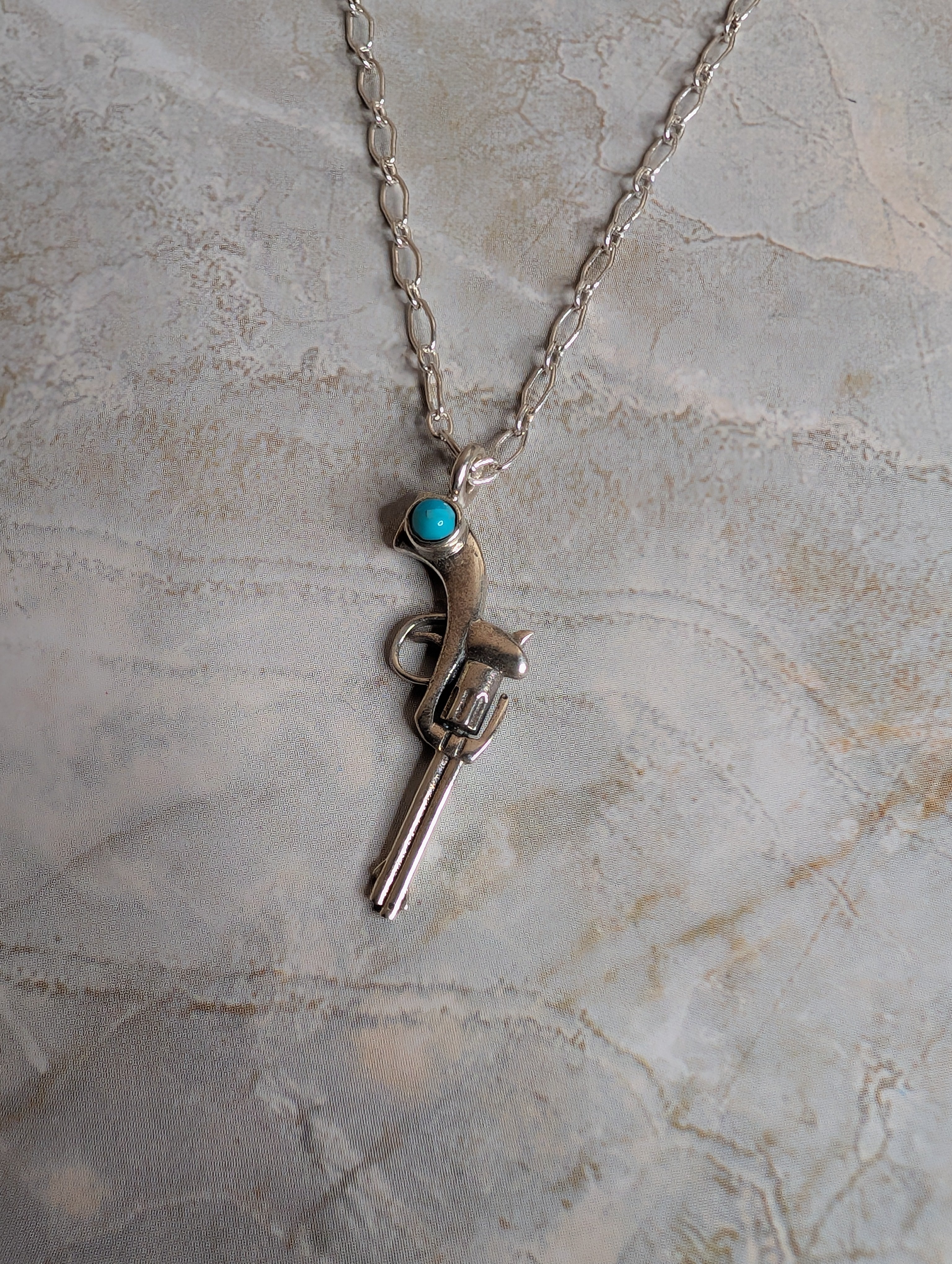Kingman Turquoise Sterling Silver Necklace With Gun Pendant