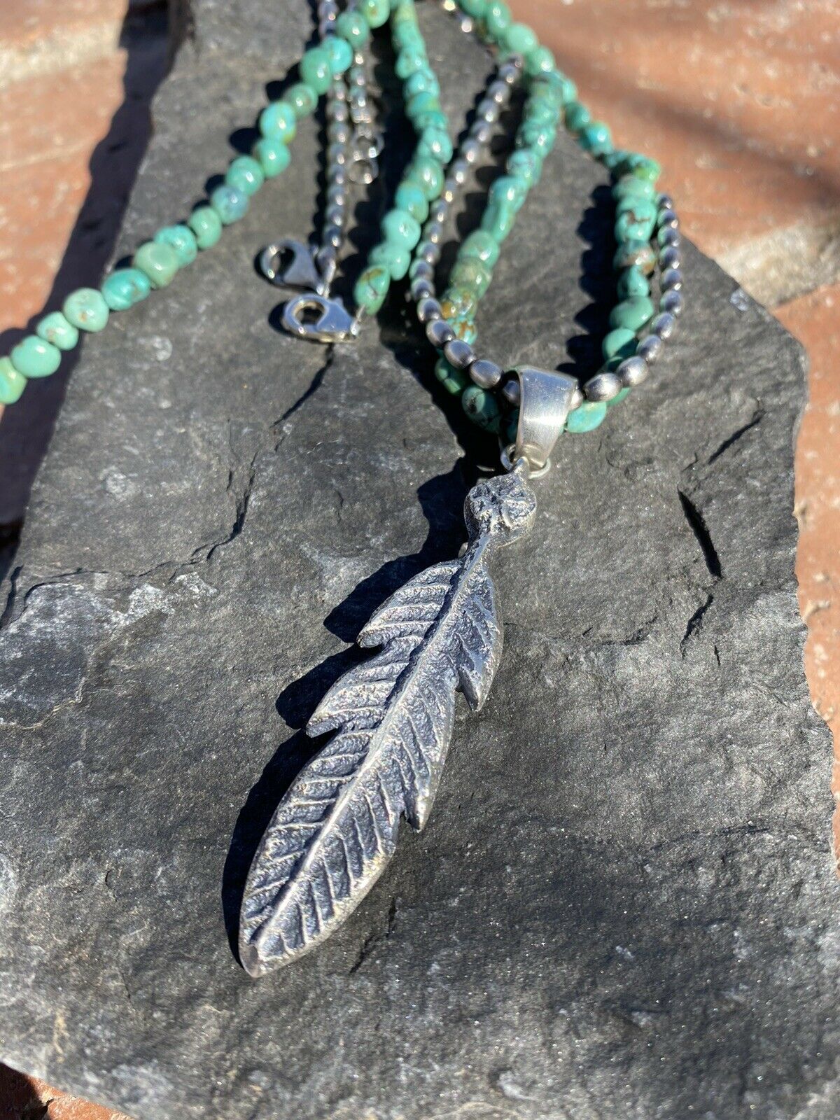Handcrafted Sterling Silver Tufa Cast Feather