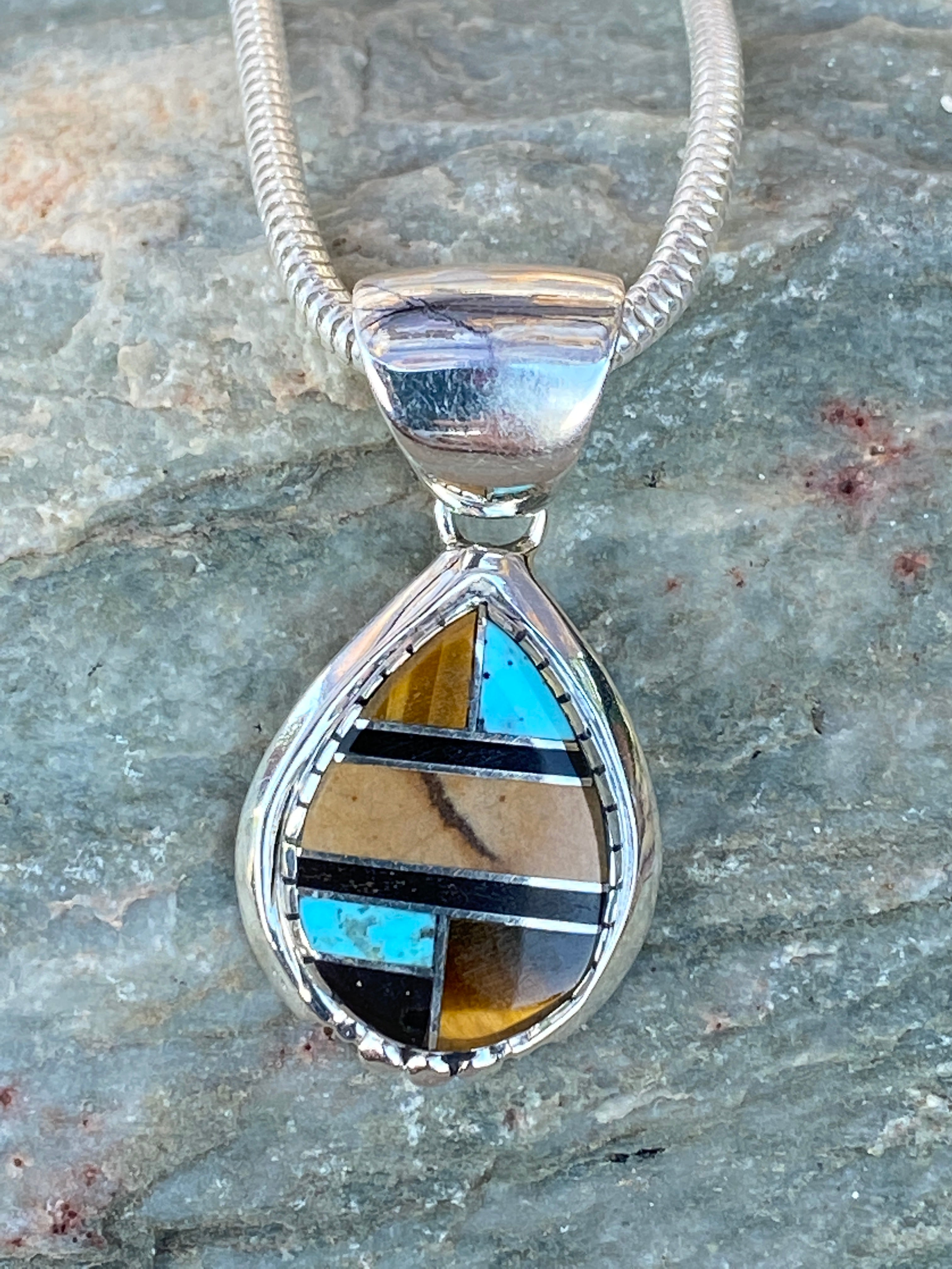 Handcrafted Turquoise petrified wood Pendant
