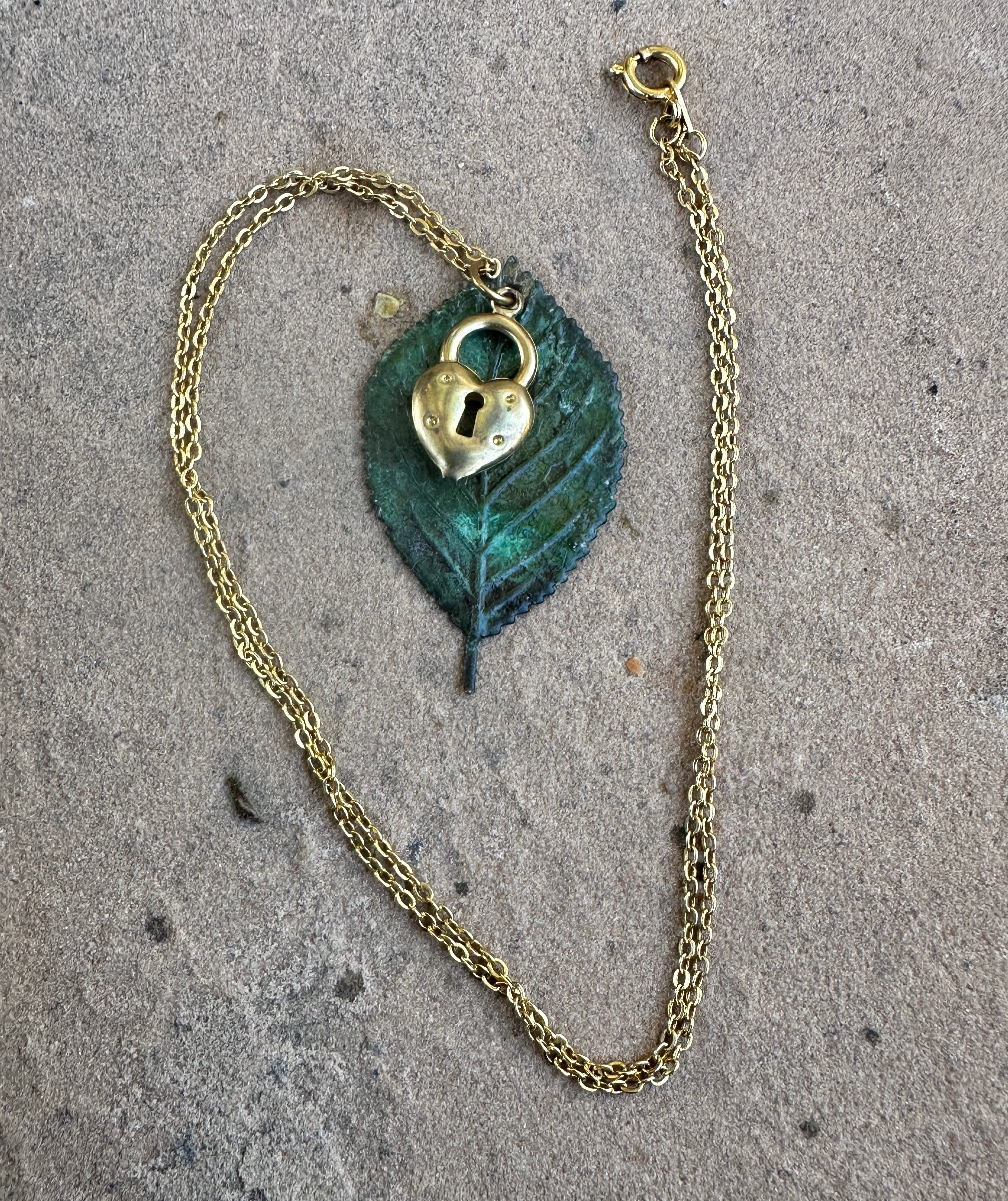 Yellow gold, brass locket, moldavite leaf pendant 18” necklace