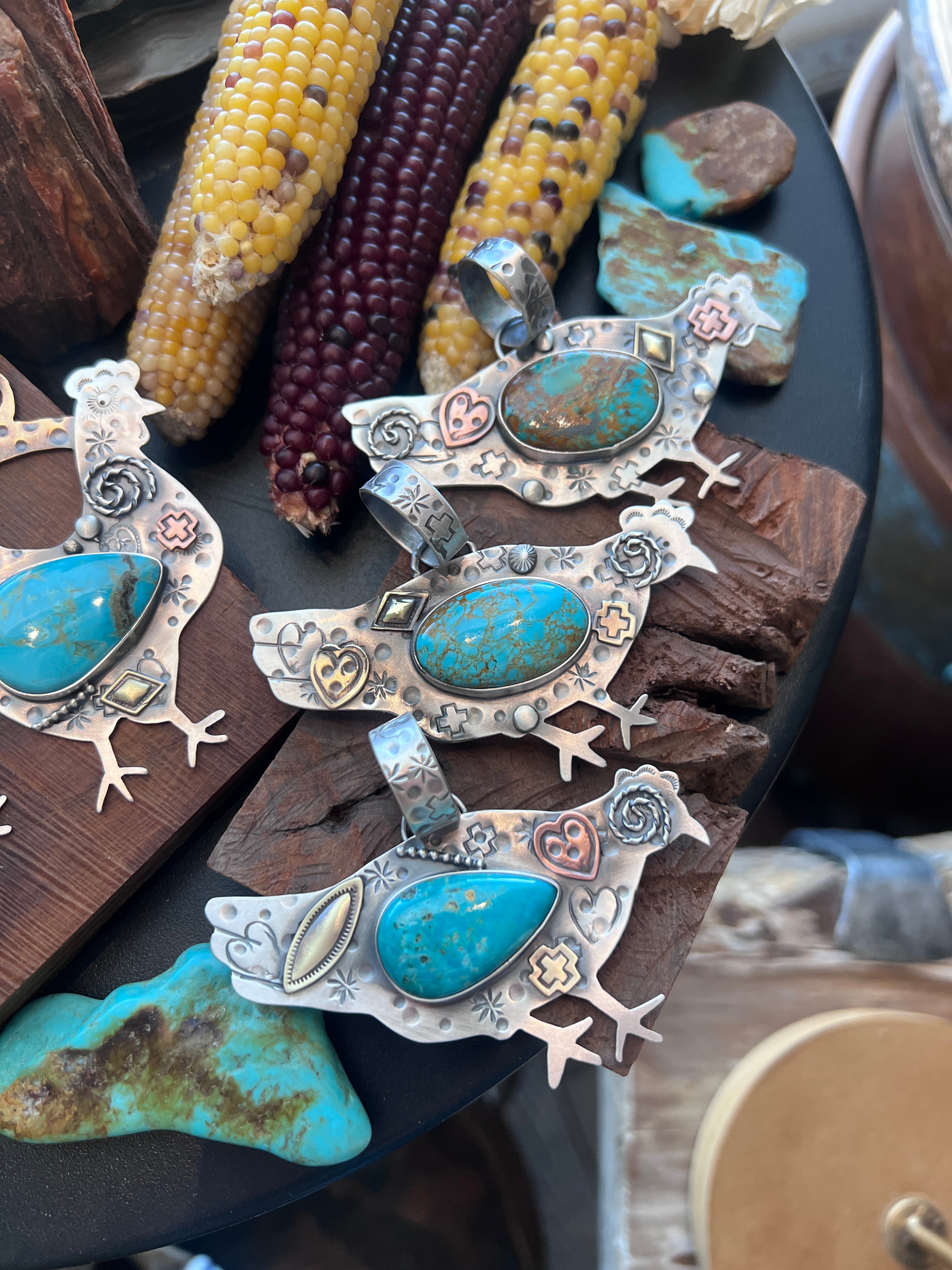 The Nizhoni Cluckers: Hand Stamped and Layered Sterling Silver, Brass, Copper & Kingman Turquoise Chicken Pendants by Kimari Somers