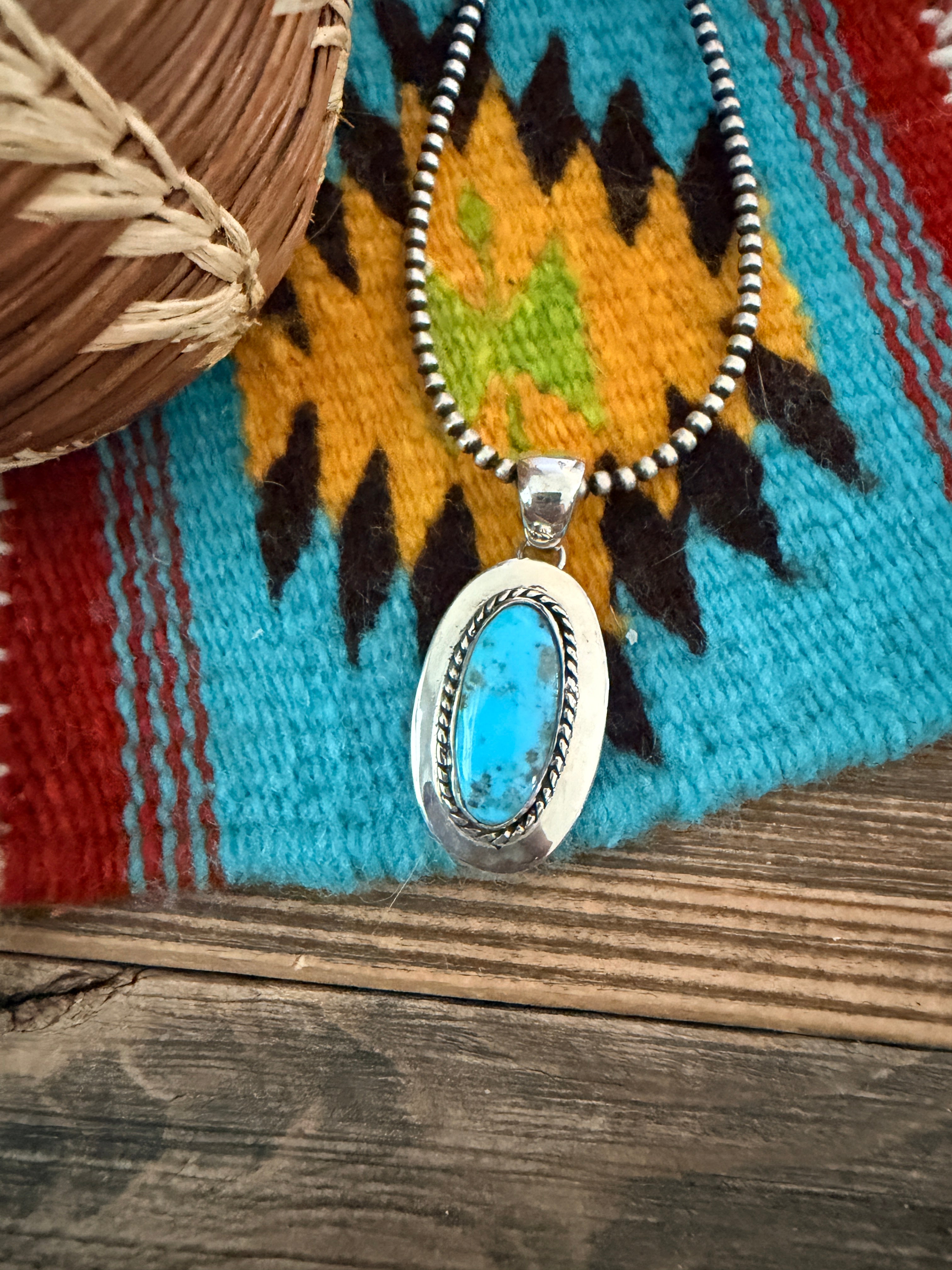 Handcrafted Sterling Silver and Turquoise Pendant by Wilford Begay