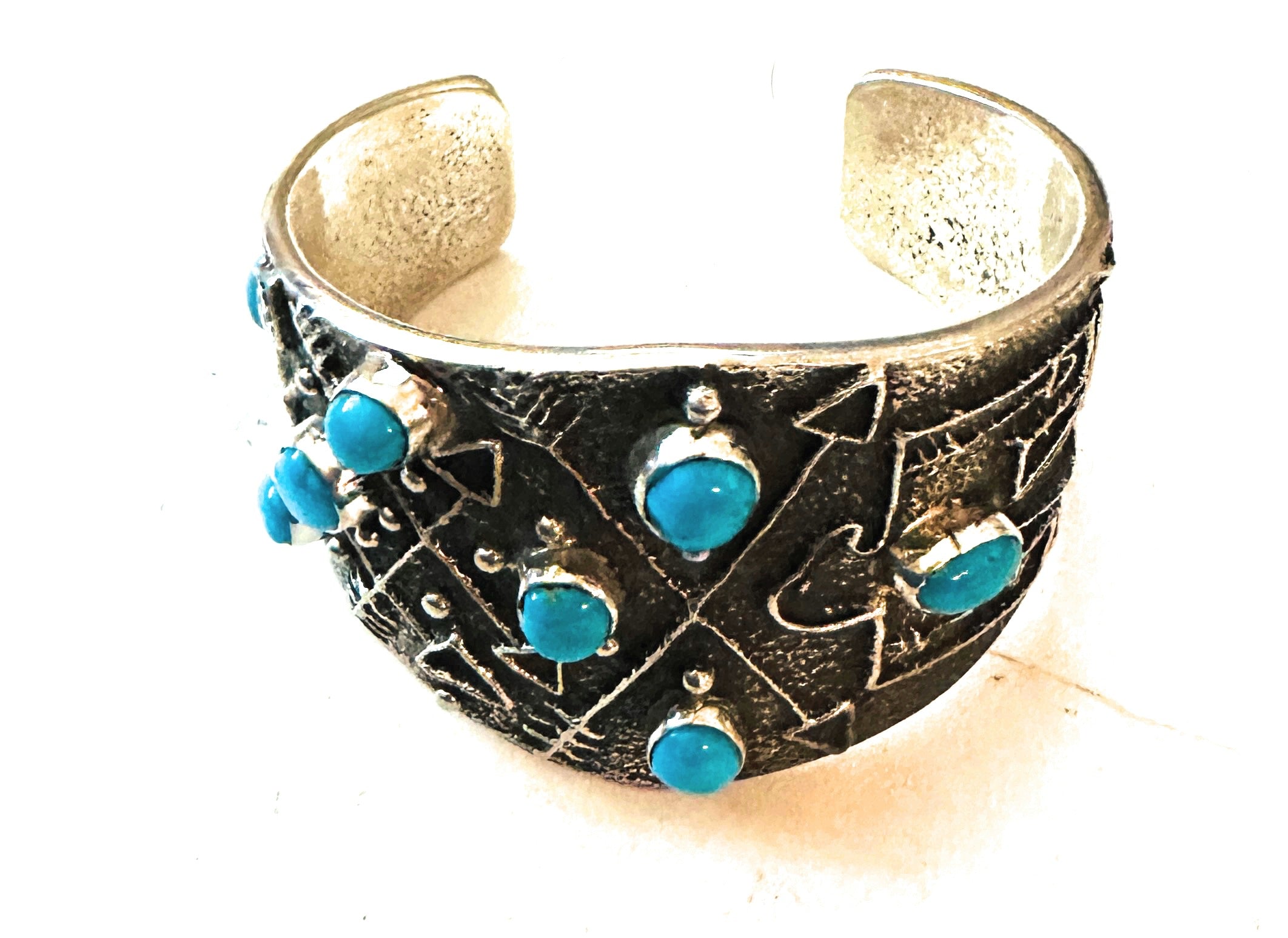 Navajo Turquoise & Sterling Silver Thunderbird Tufa Cast Cuff Bracelet by Delbert Arviso