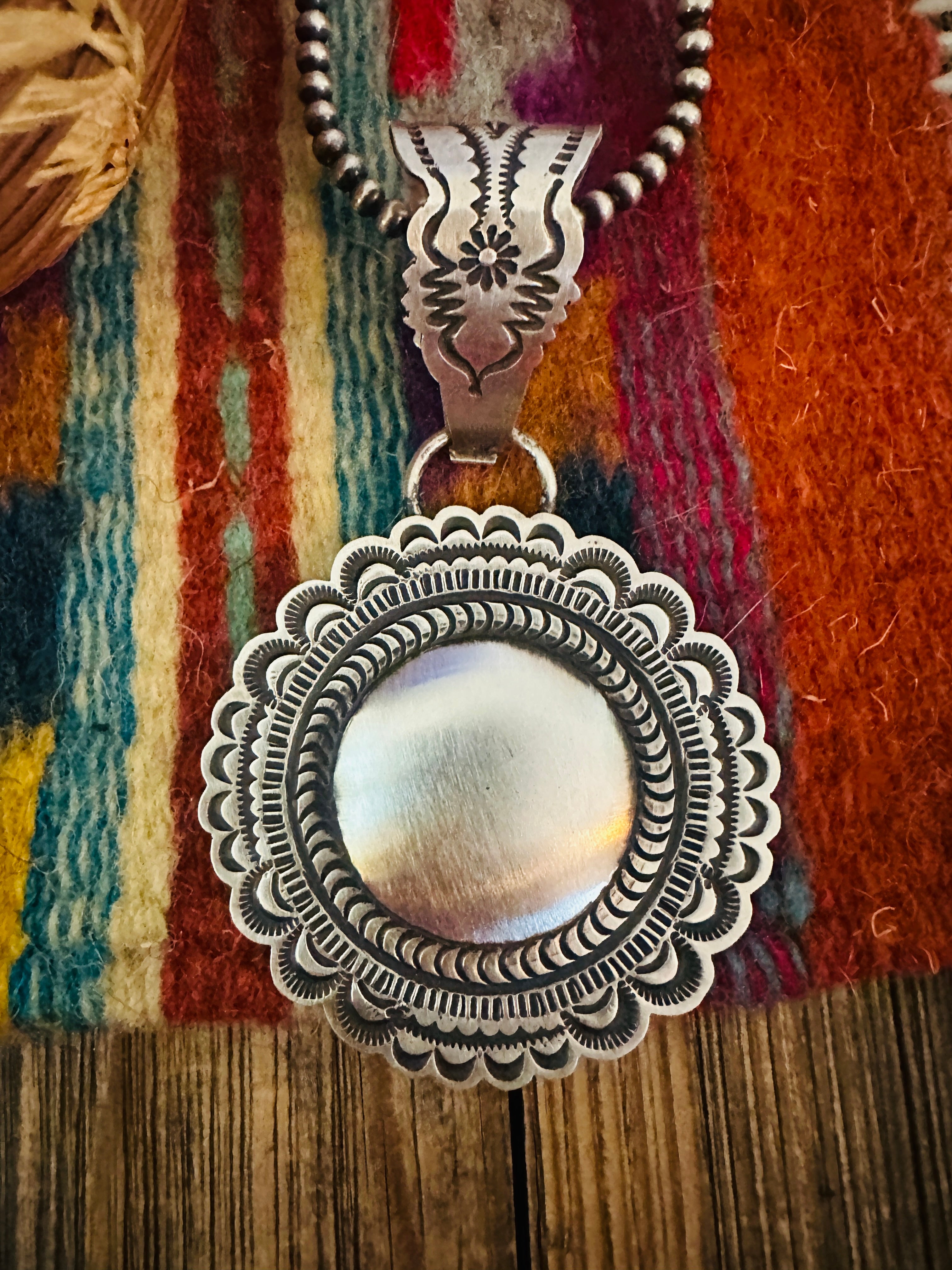 Handcrafted Sterling Silver Concho Pendant by Leander Tahe