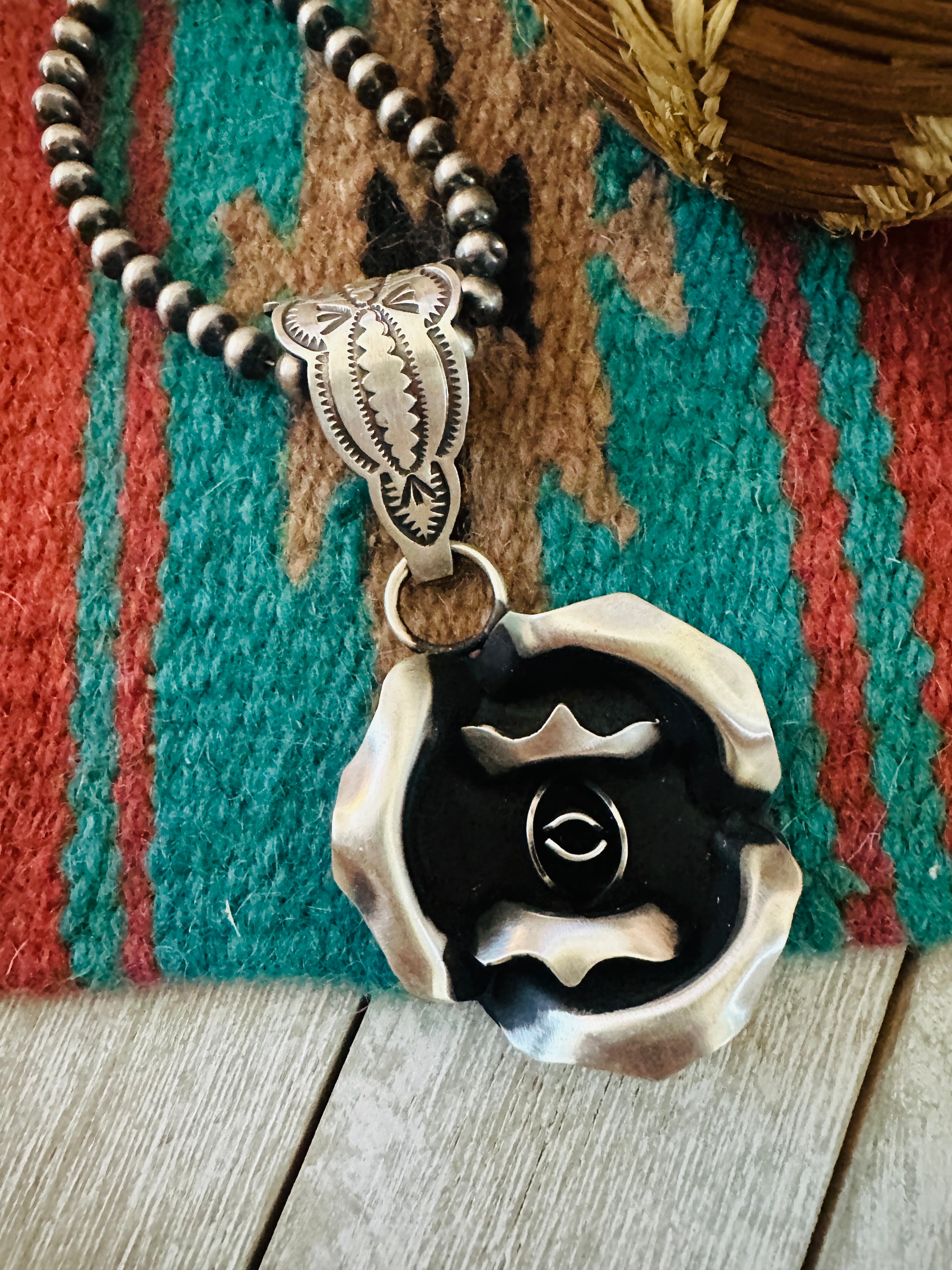 Handcrafted Sterling Silver Rose Pendant by Leander Tahe