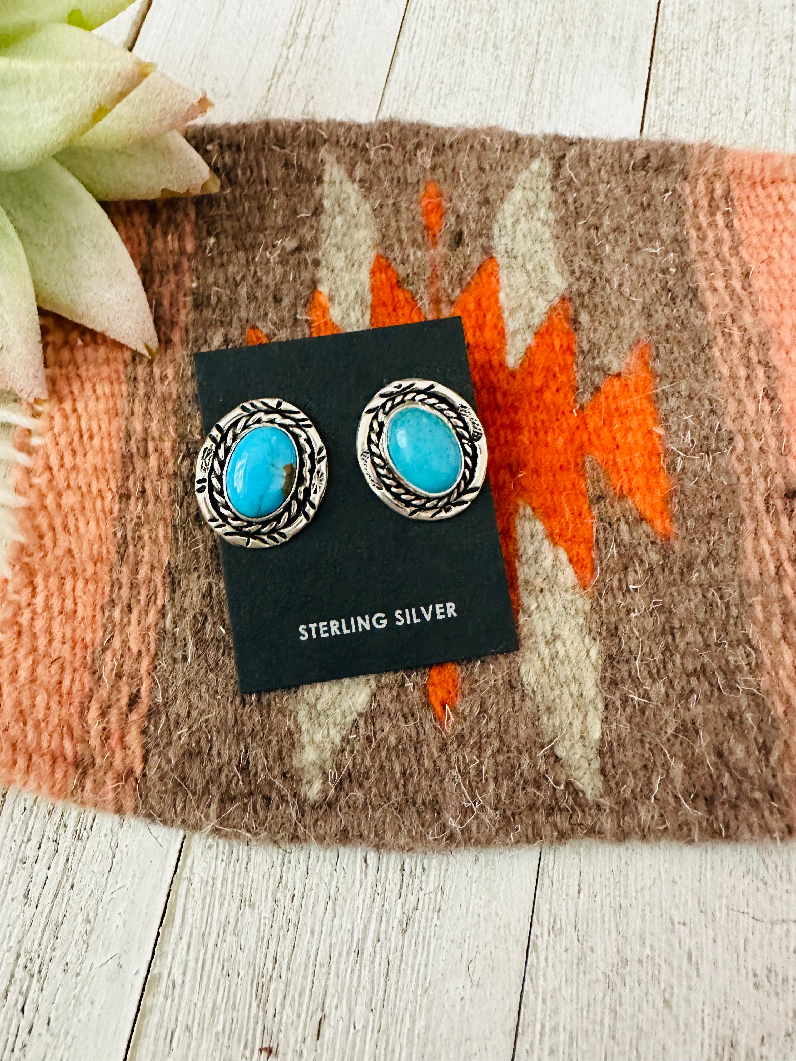 Turquoise oval earrings in sterling store silver.