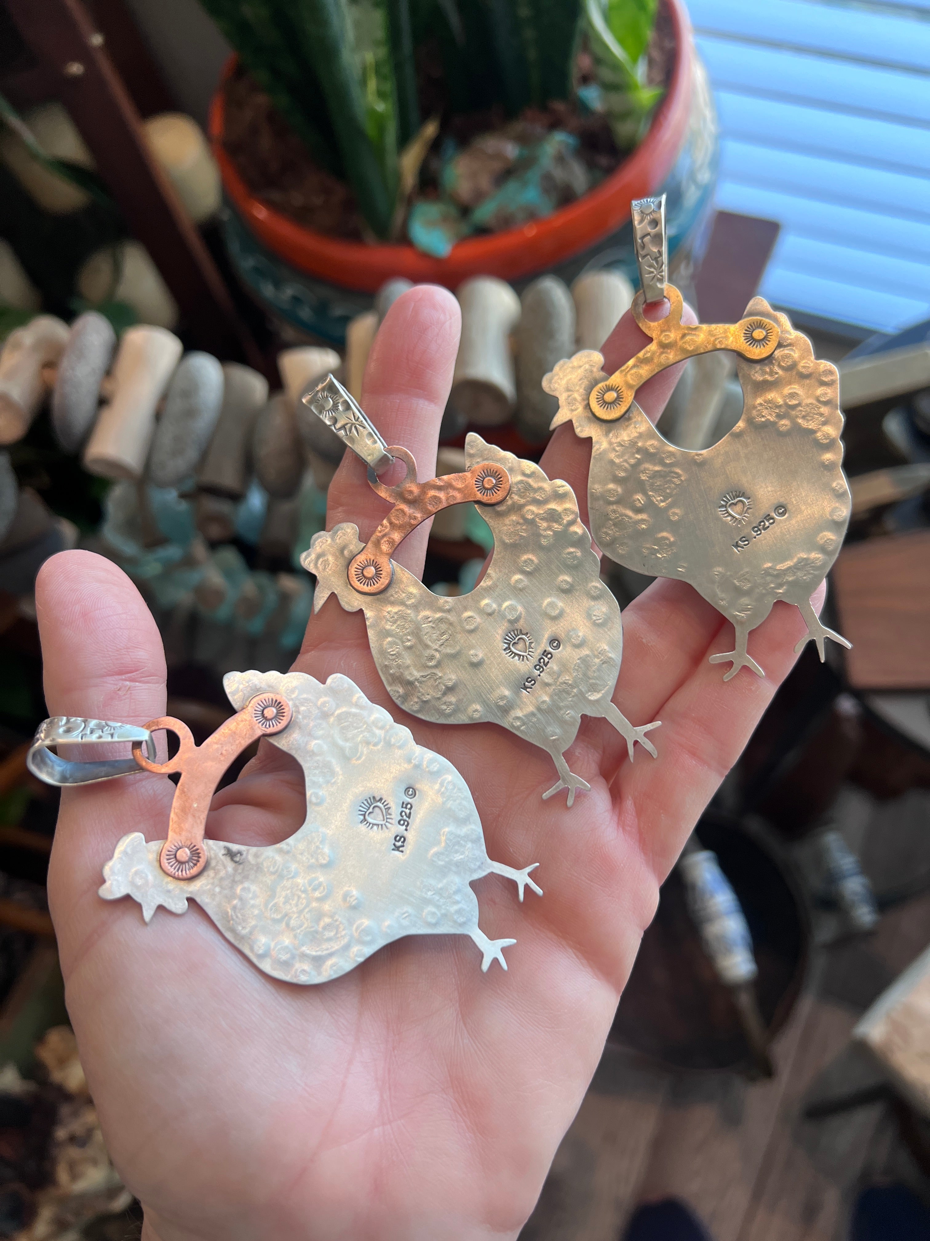 The Nizhoni Cluckers: Hand Stamped and Layered Sterling Silver, Brass, Copper & Kingman Turquoise Chicken Pendants by Kimari Somers