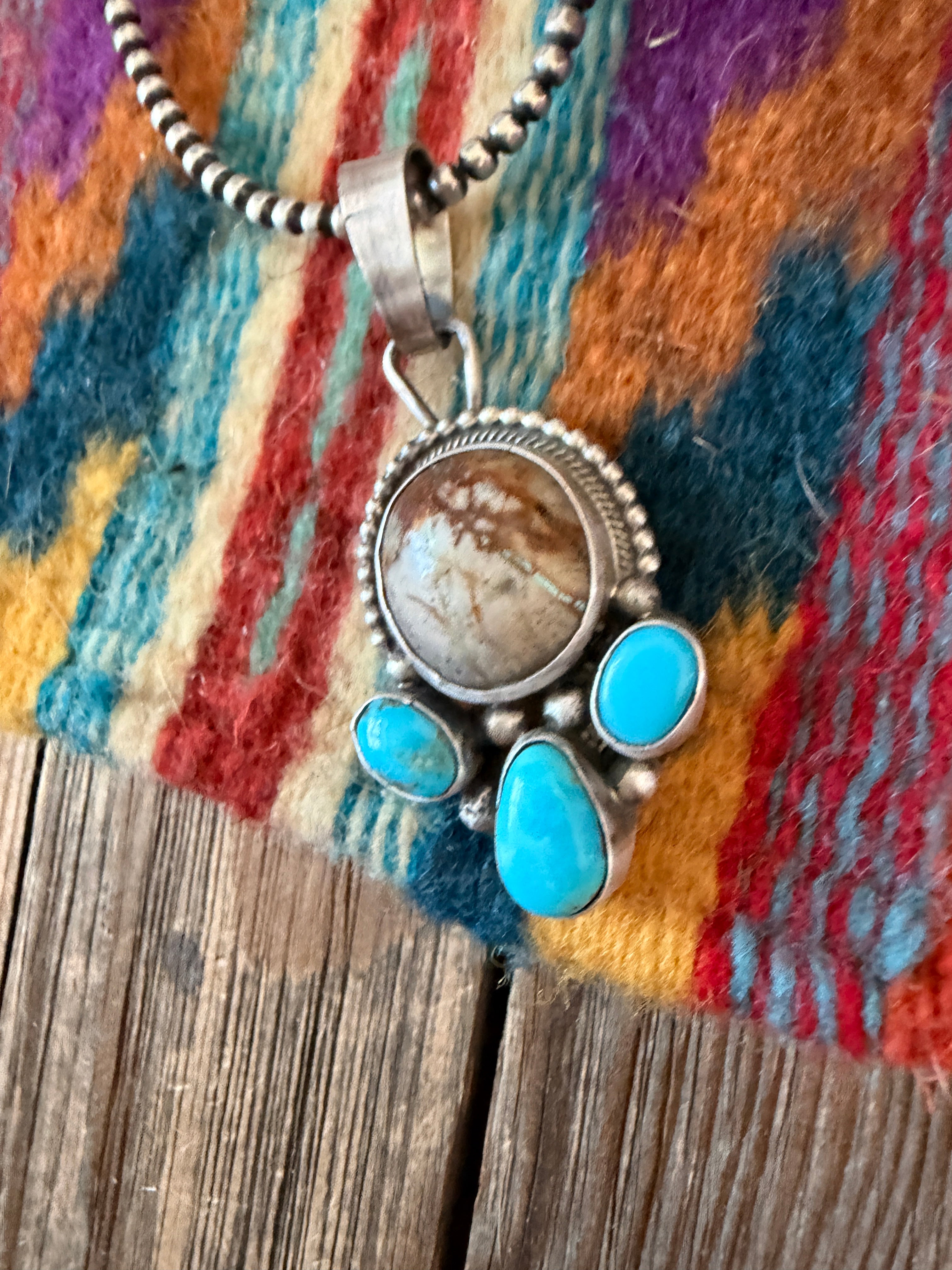 Handcrafted Sterling Silver & Turquoise Pendant by Travis Jim