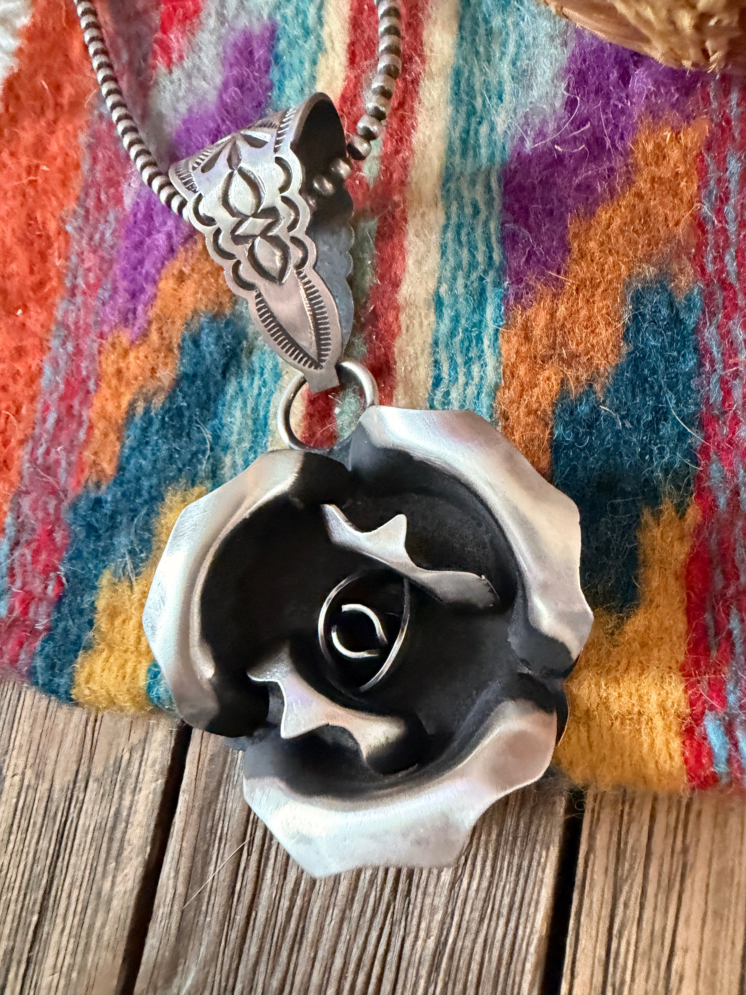 Handcrafted Sterling Silver Rose Pendant by Leander Tahe