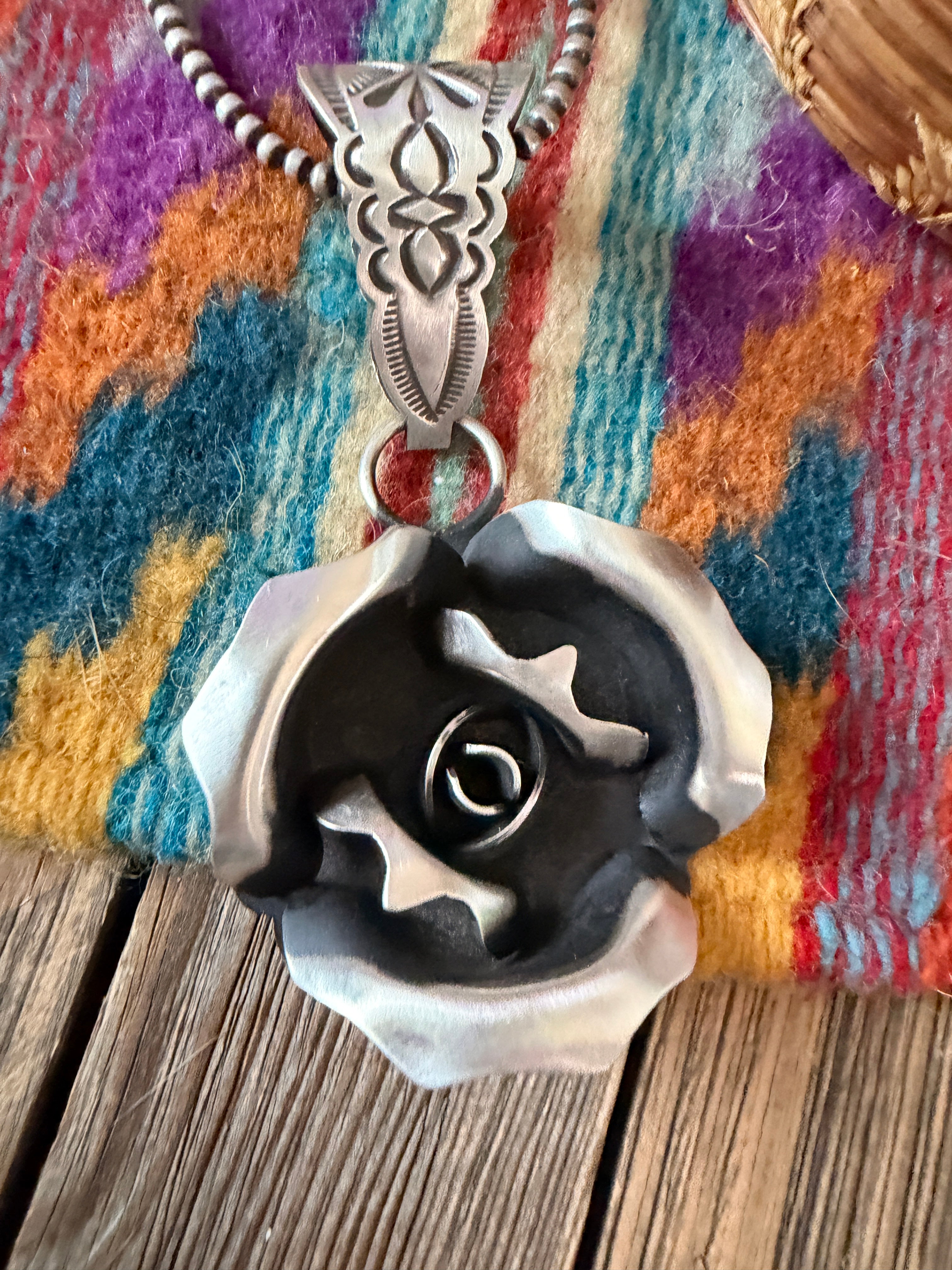 Handcrafted Sterling Silver Rose Pendant by Leander Tahe
