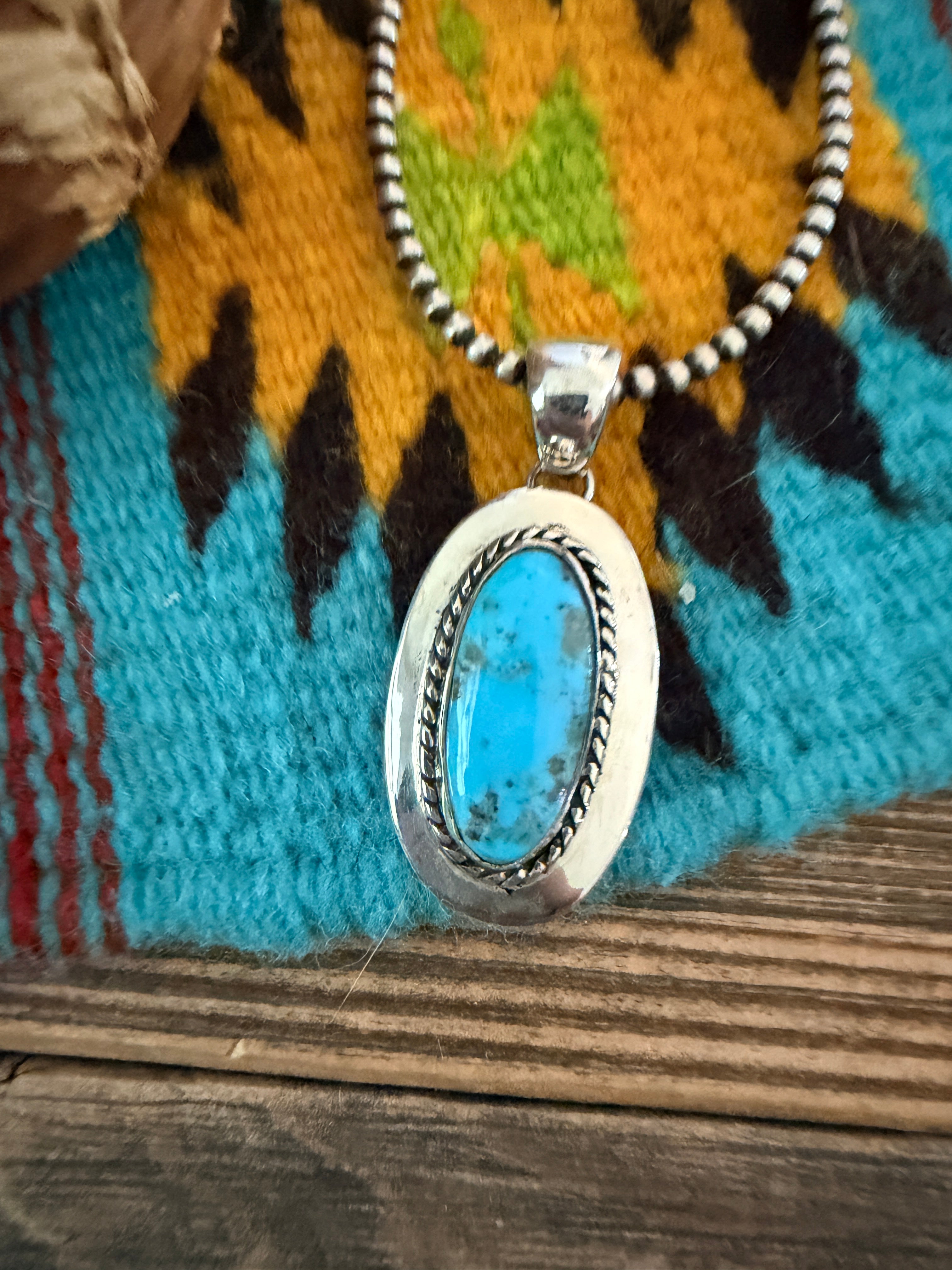Handcrafted Sterling Silver and Turquoise Pendant by Wilford Begay
