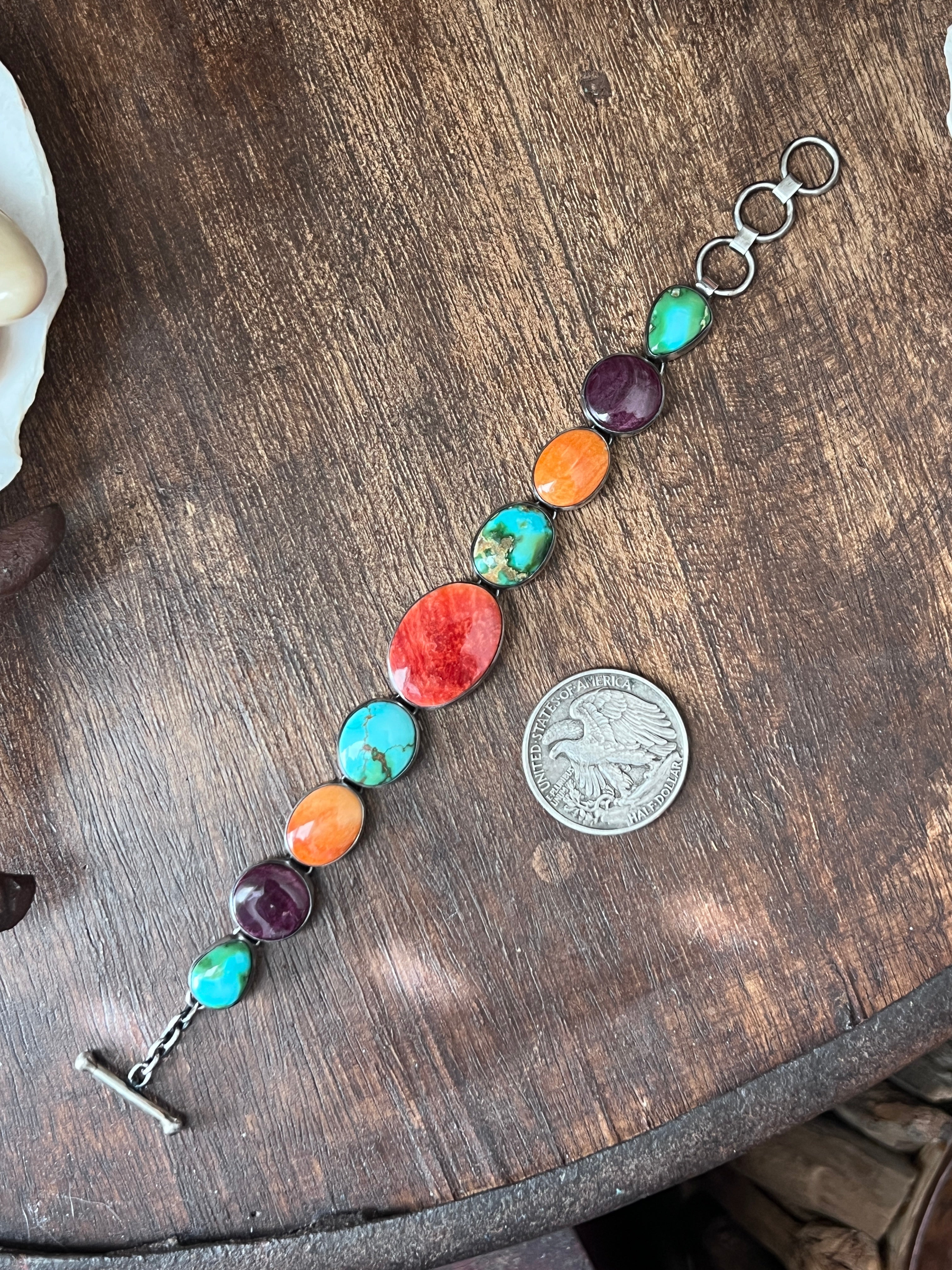 Loretta Delgarito Sterling Silver Electric Rainbow Link Turquoise and Spiny Oyster Bracelet: Ovals, Circles and Pears