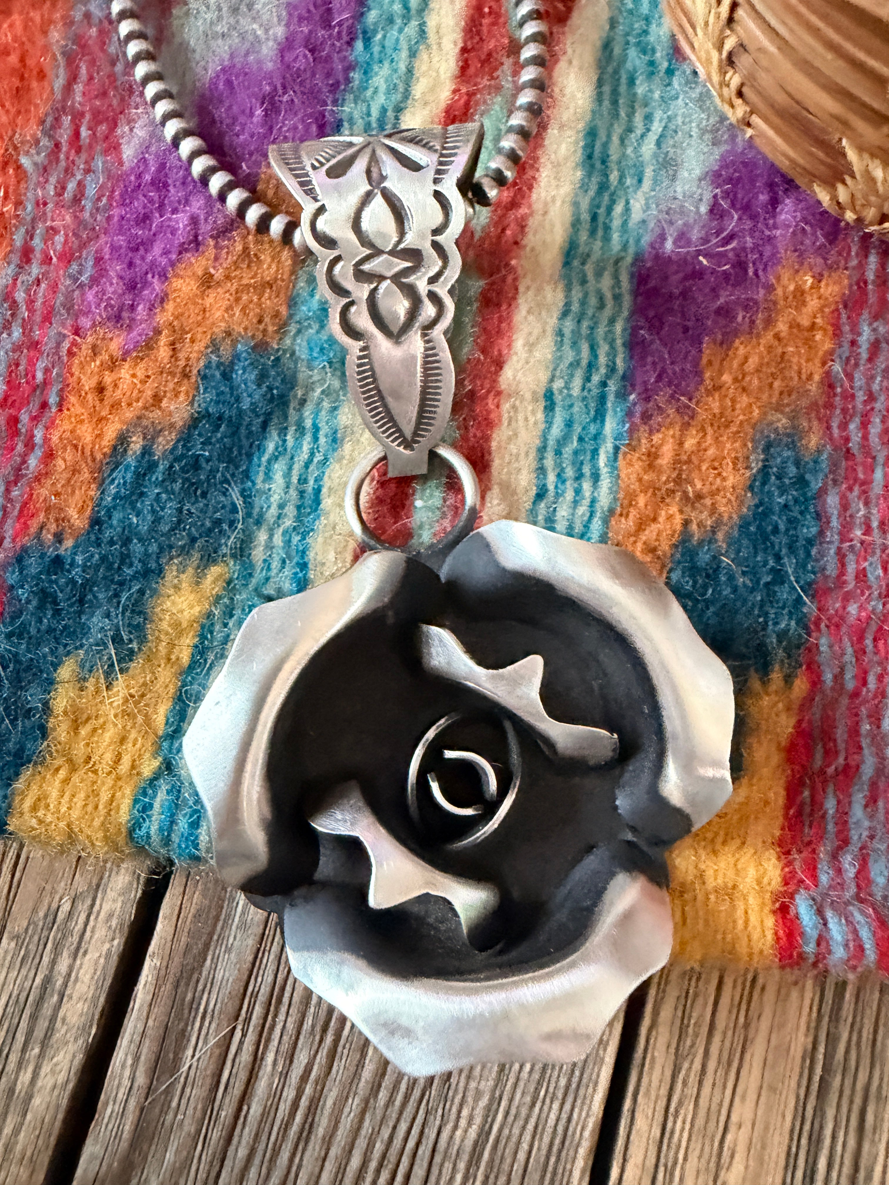 Handcrafted Sterling Silver Rose Pendant by Leander Tahe