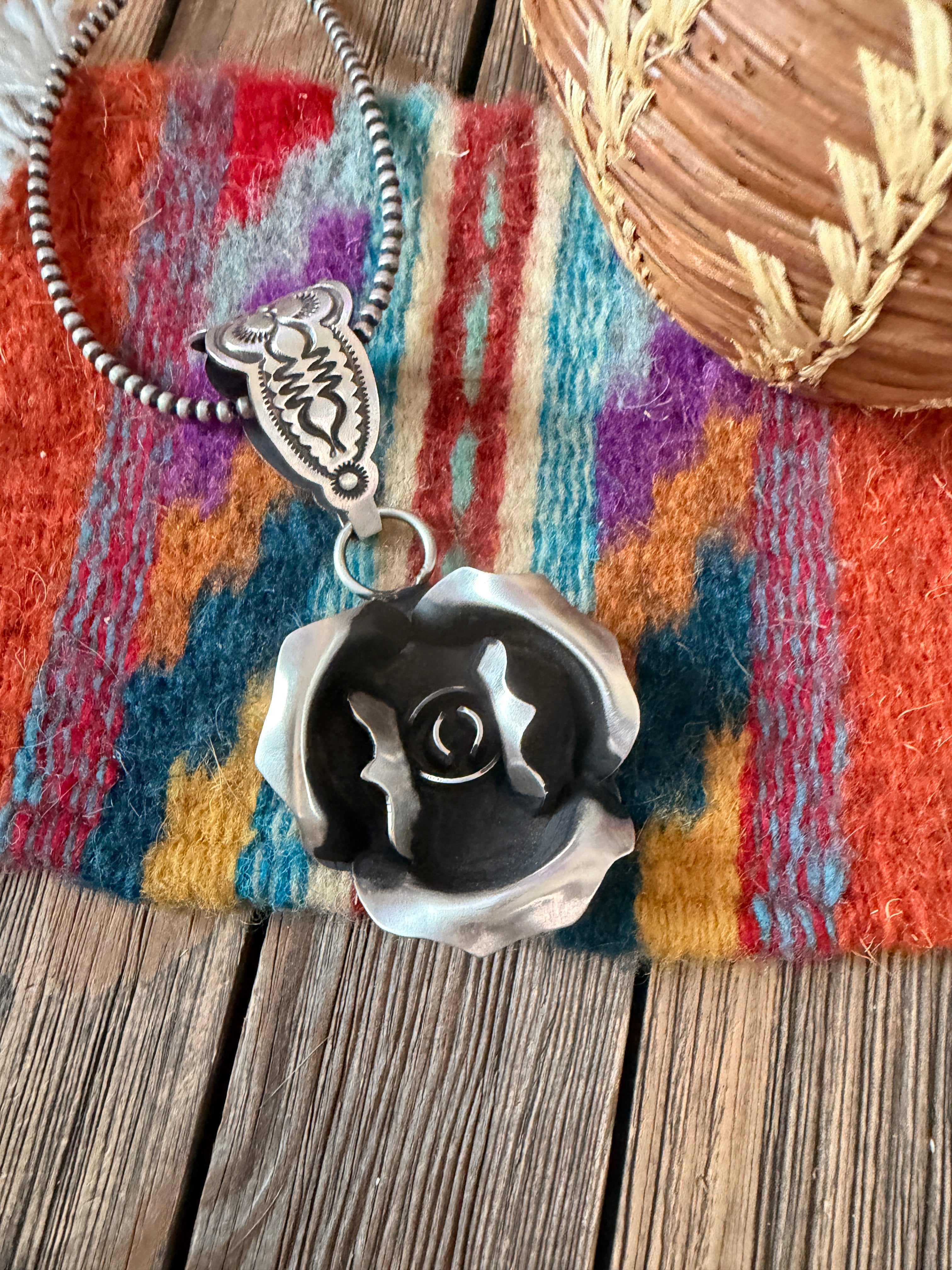 Handcrafted Sterling Silver Rose Pendant by Leander Tahe