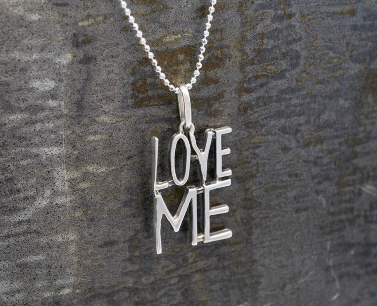 Love Me Pendant Necklace