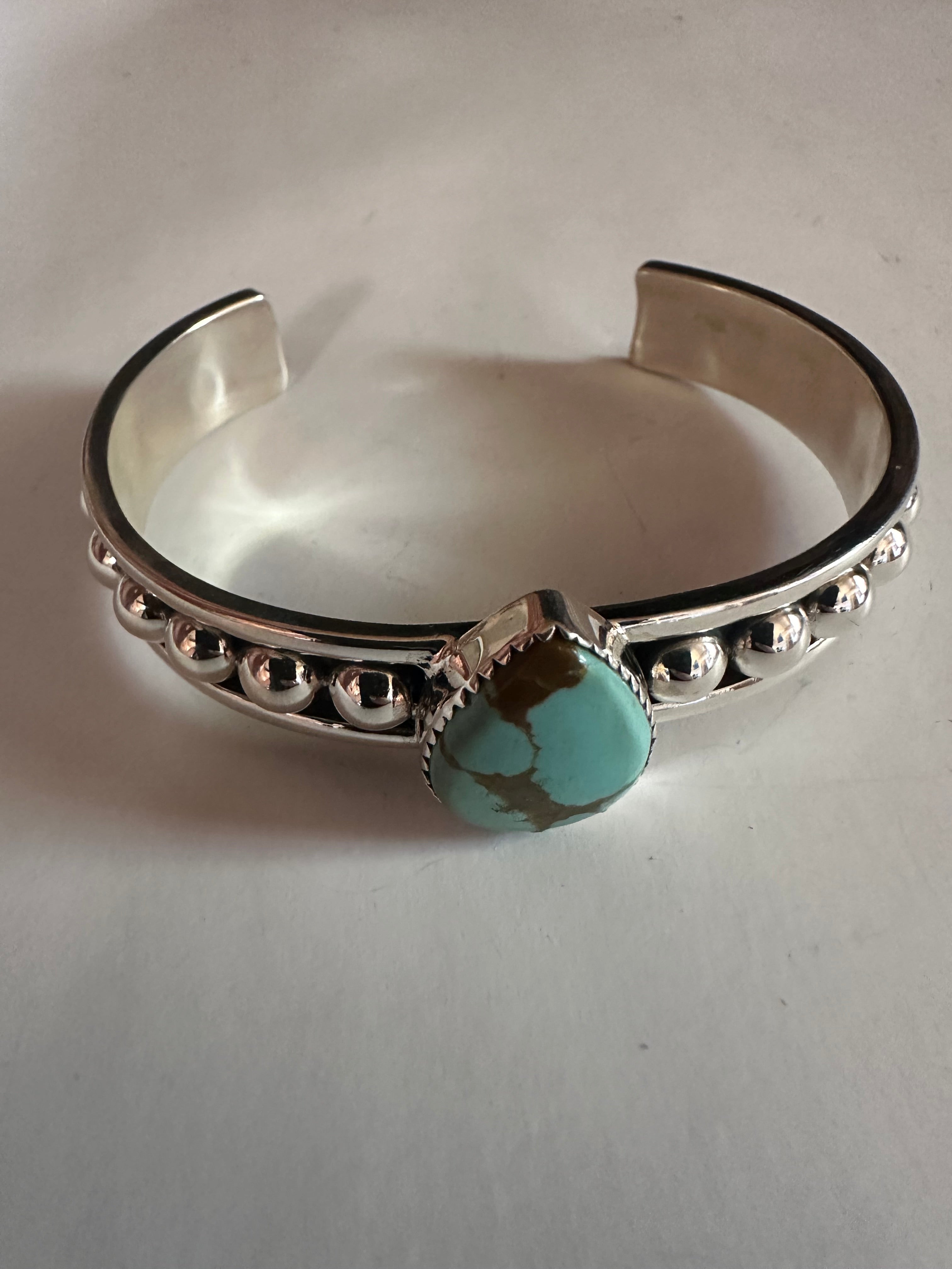 Handcrafted silver and offers turquoise adjustable bracelet.