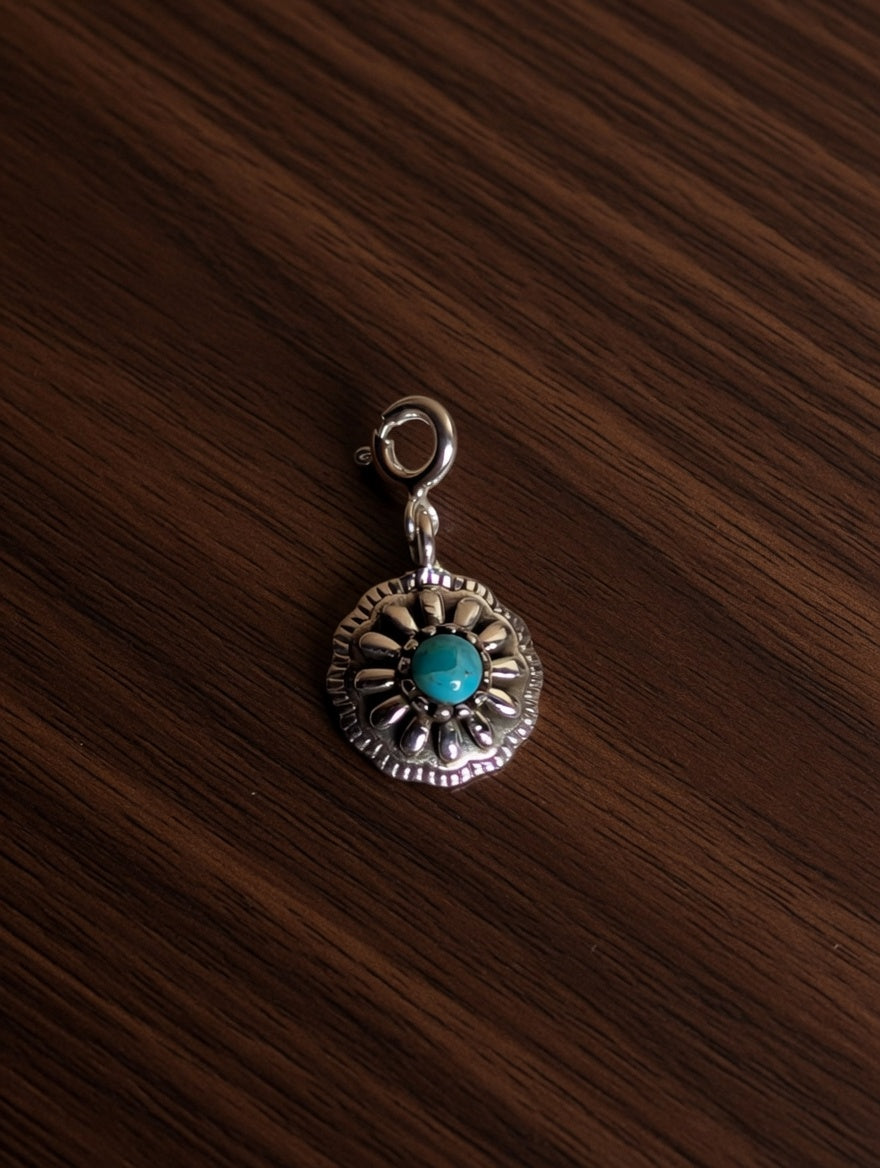 Sterling Silver Southwestern Style Rounded Sunburst Flower Charm With Turquoise