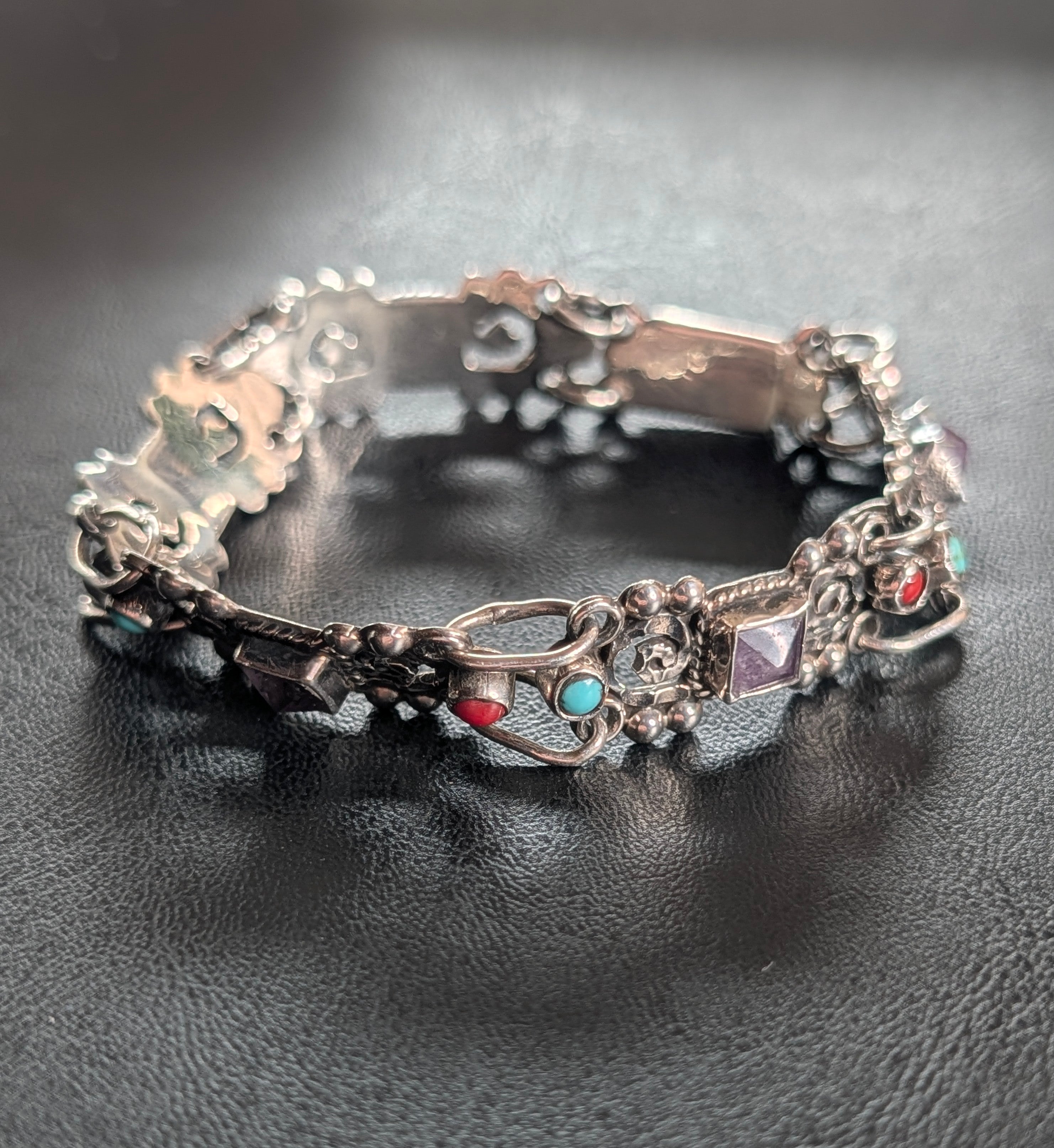 Turquoise, Amethyst, and Coral Intricate Sterling Silver Bracelet