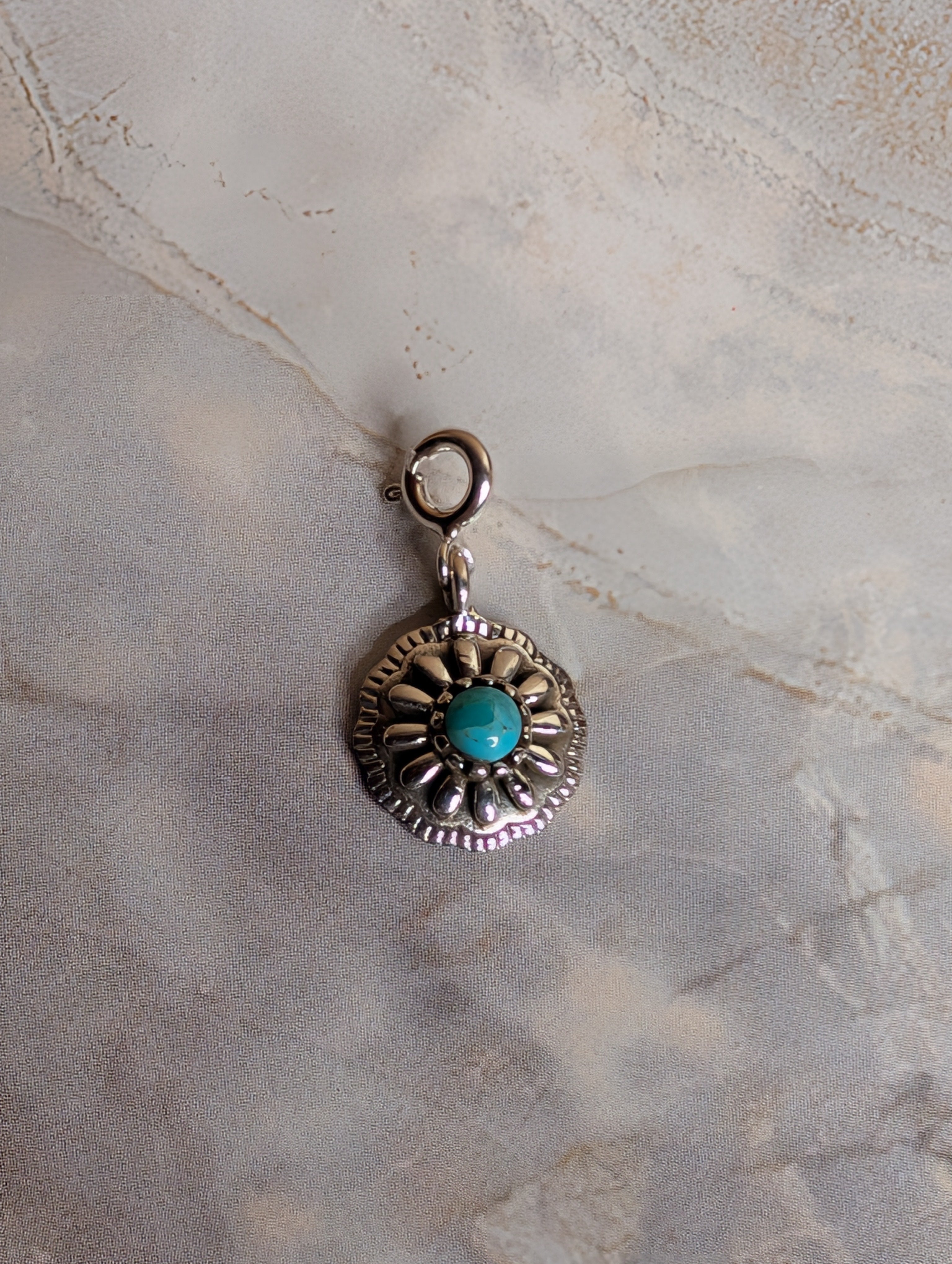 Sterling Silver Southwestern Style Rounded Sunburst Flower Charm With Turquoise
