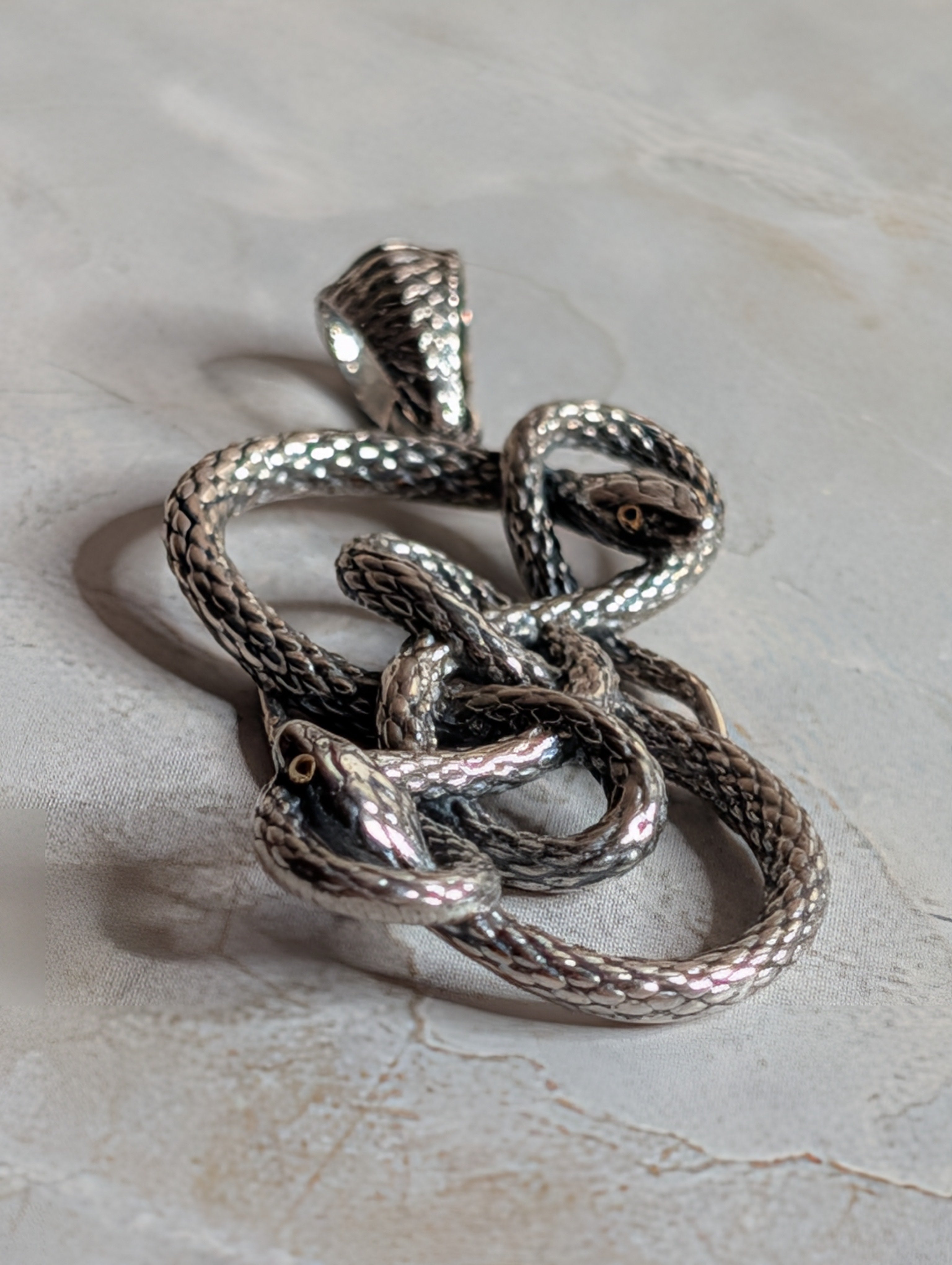 Sterling Silver Round Two Connected Snakes Pendant With 18k Gold Accents