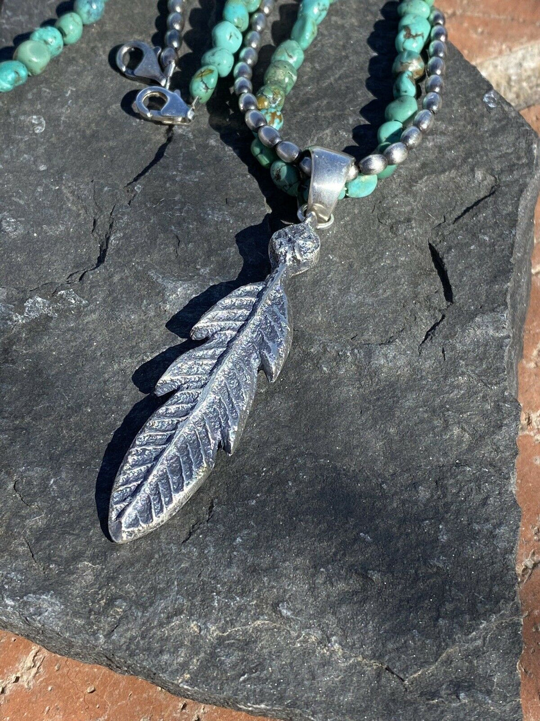 Handcrafted Sterling Silver Tufa Cast Feather