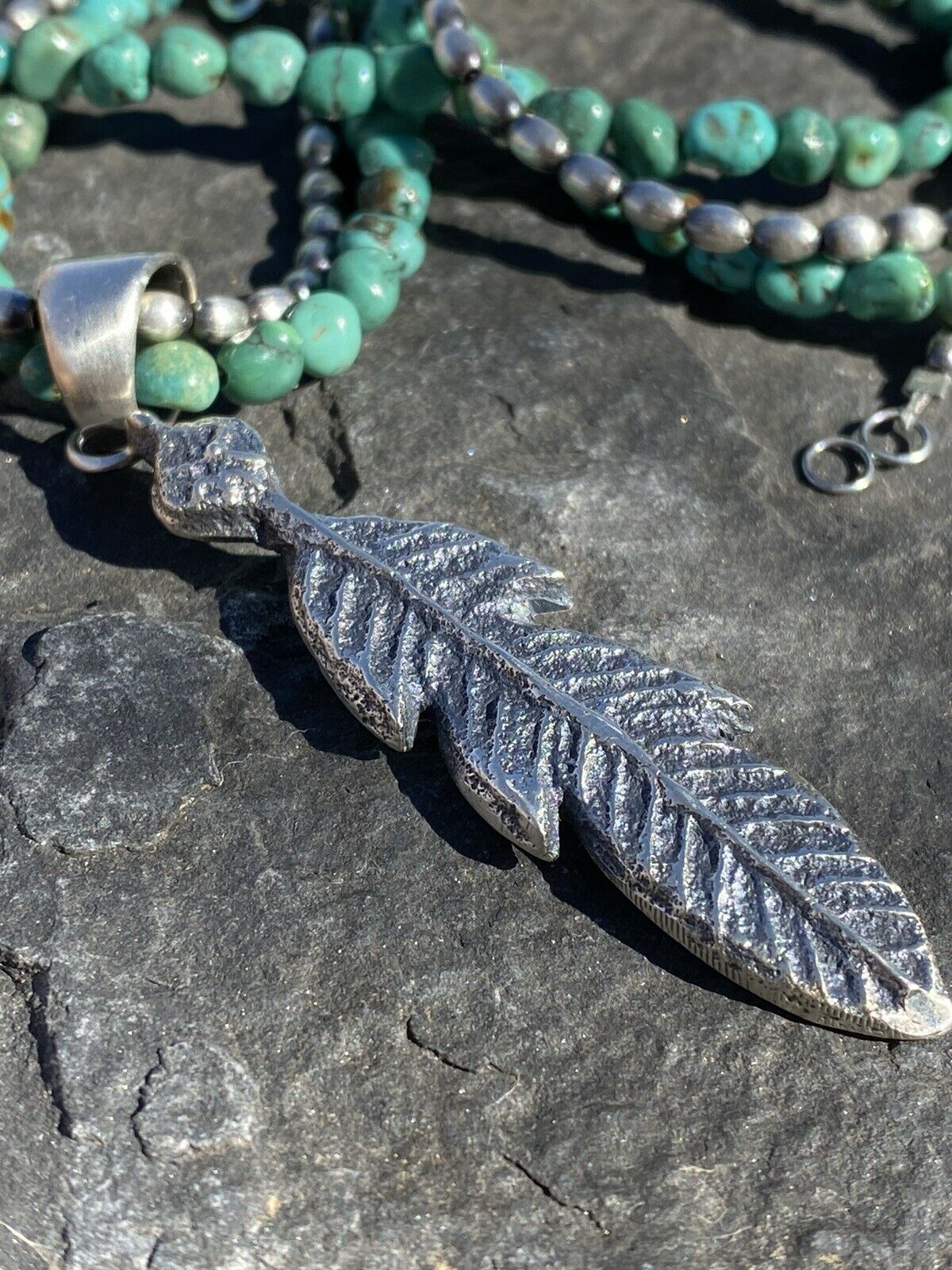 Navajo Sterling Silver Tufa Cast Feather